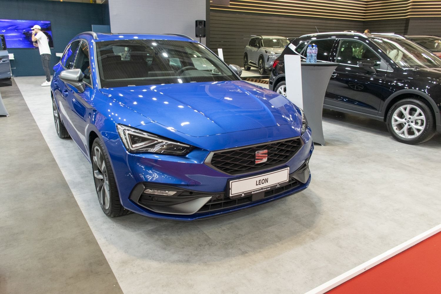 Blue car with distinctive front grille and sharp LED headlights