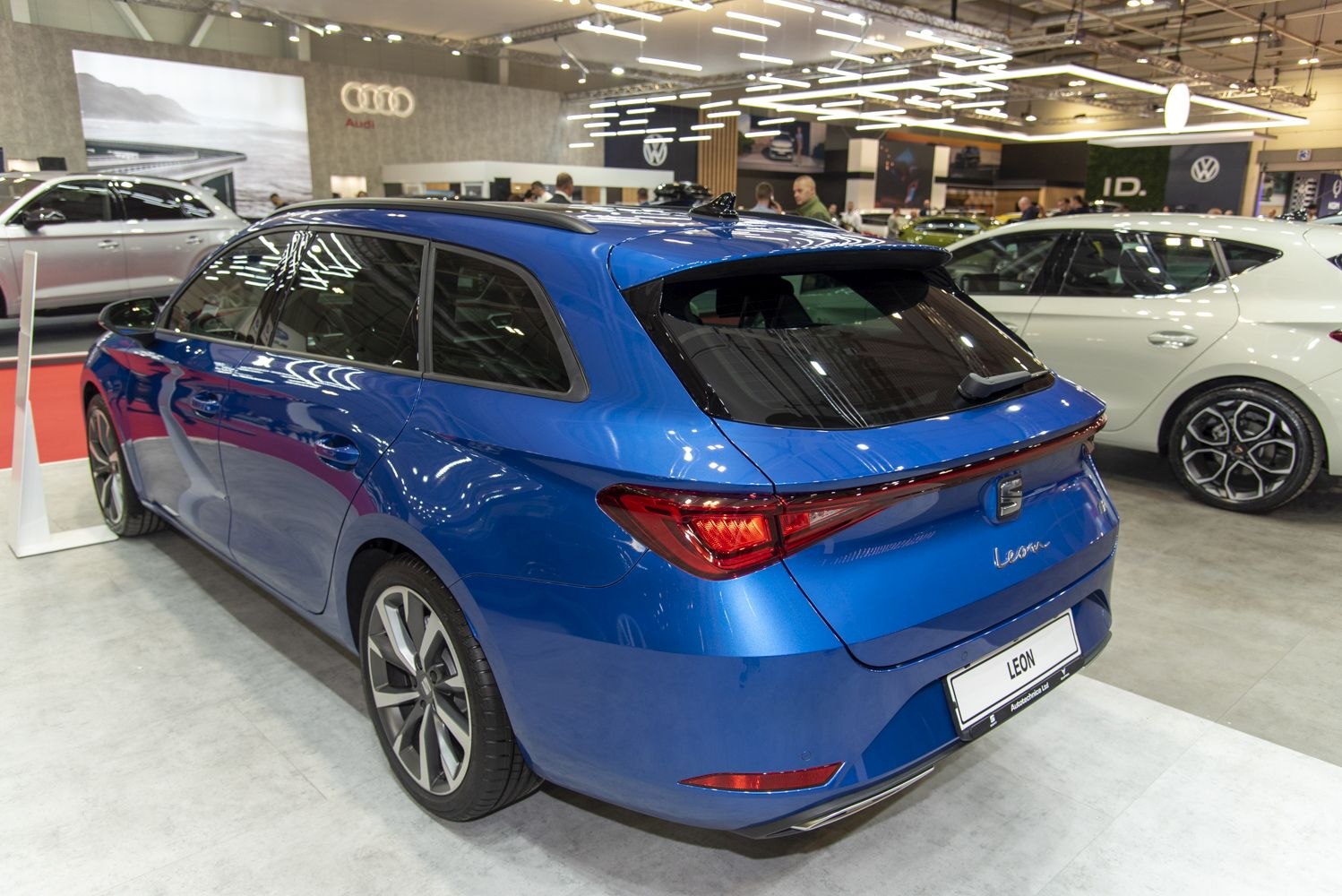 Rear-side view of a blue hatchback with LED tail lights and alloy wheels