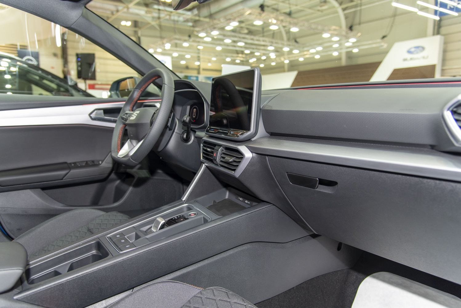 Digital instrument cluster and touchscreen infotainment with minimalist center console