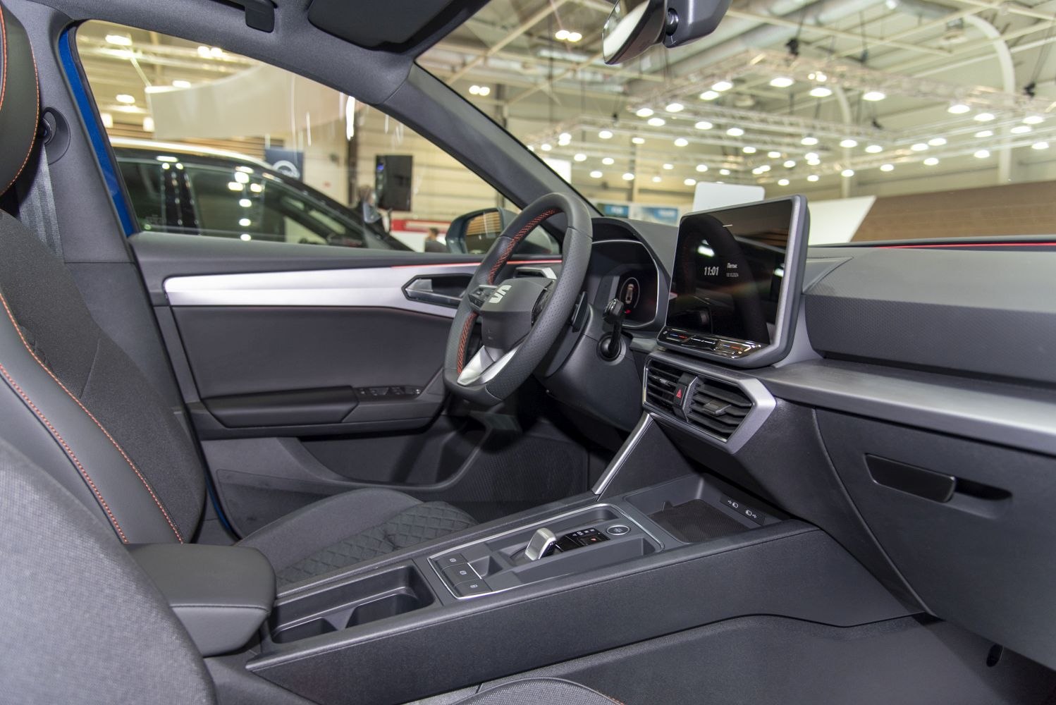 Modern car interior with digital cockpit and touchscreen infotainment system