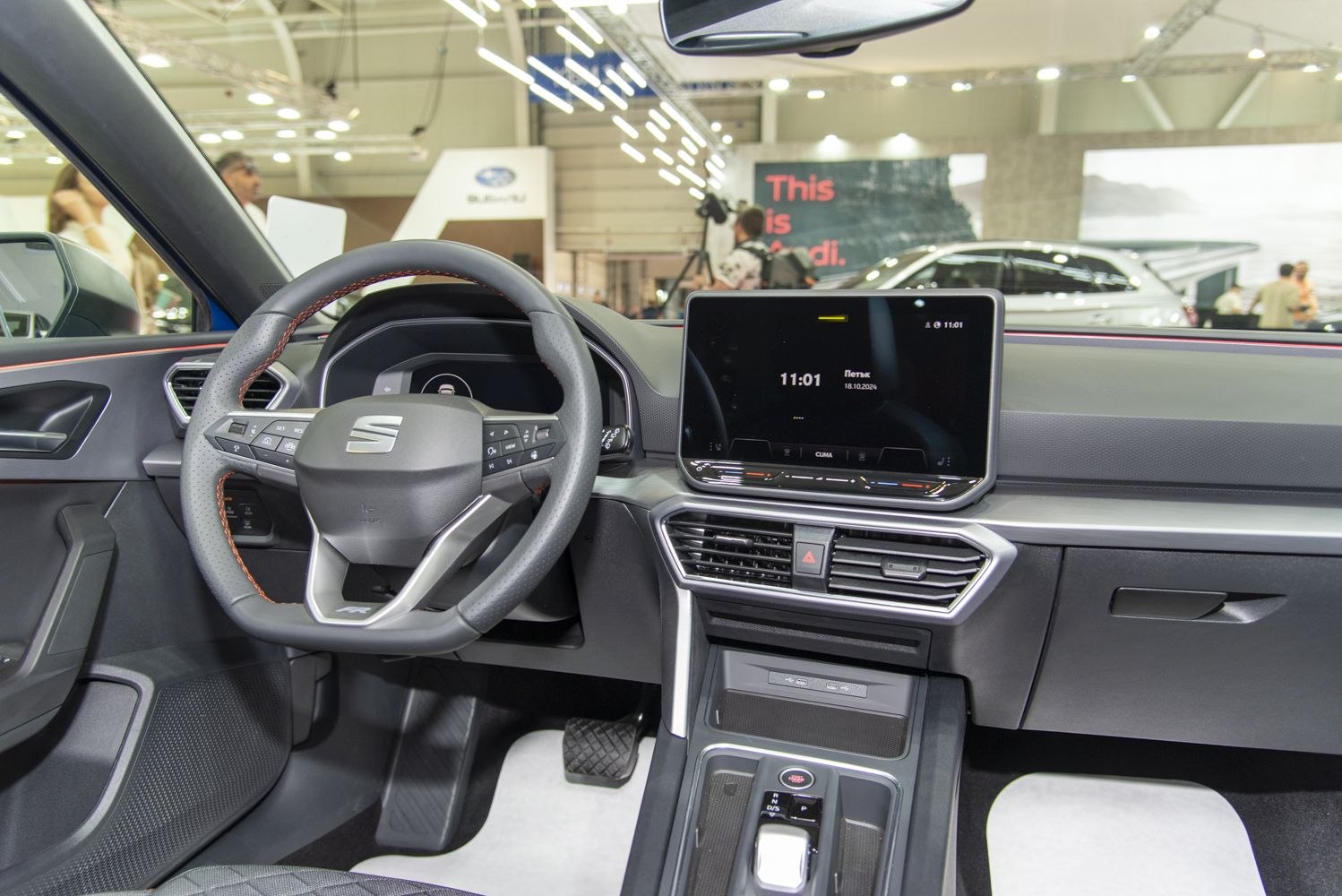 Digital dashboard and central touchscreen display with steering wheel controls