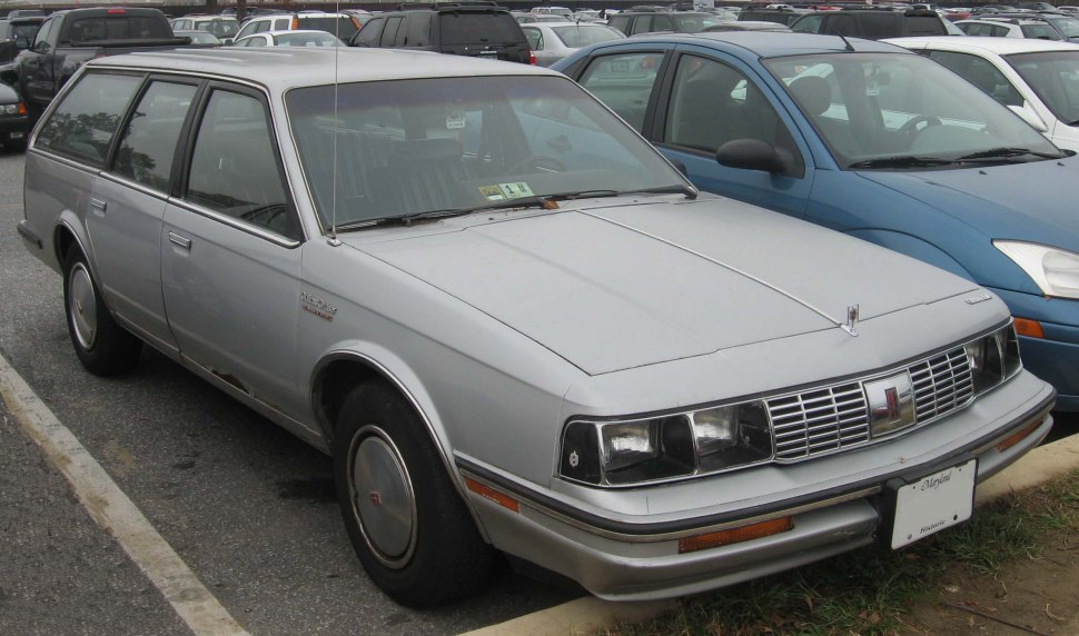 Silver station wagon with rectangular headlights and chrome grille