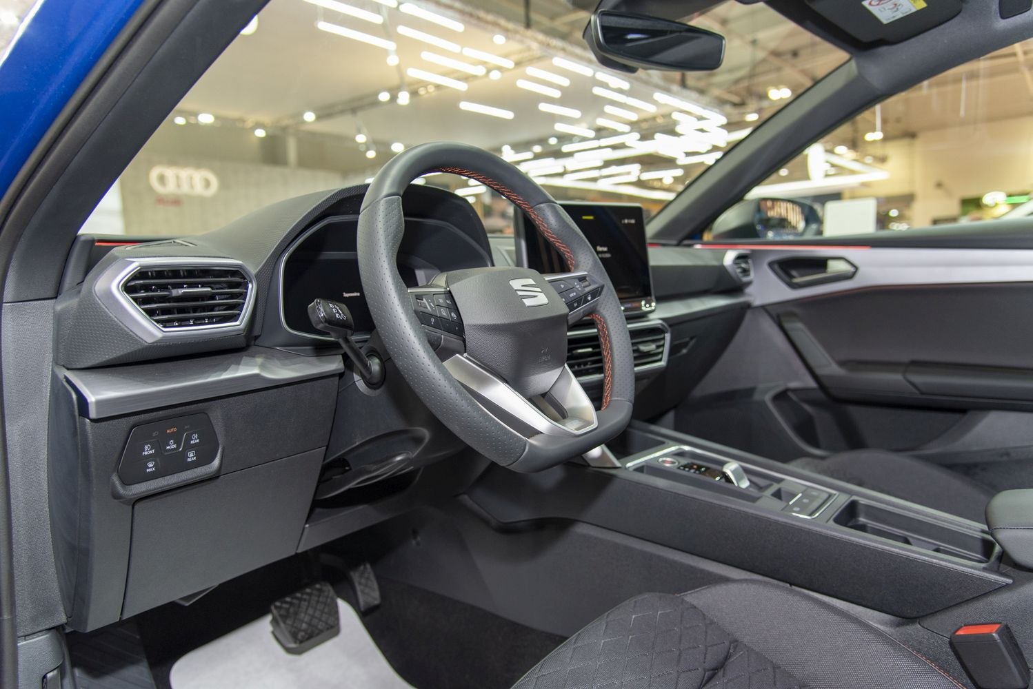 Steering wheel with controls, digital dashboard, touchscreen center console