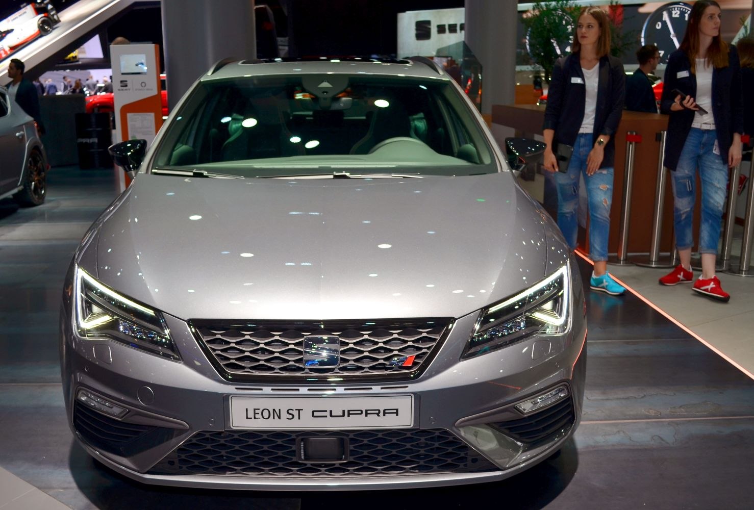 Car front with sharp LED headlights and sporty grille