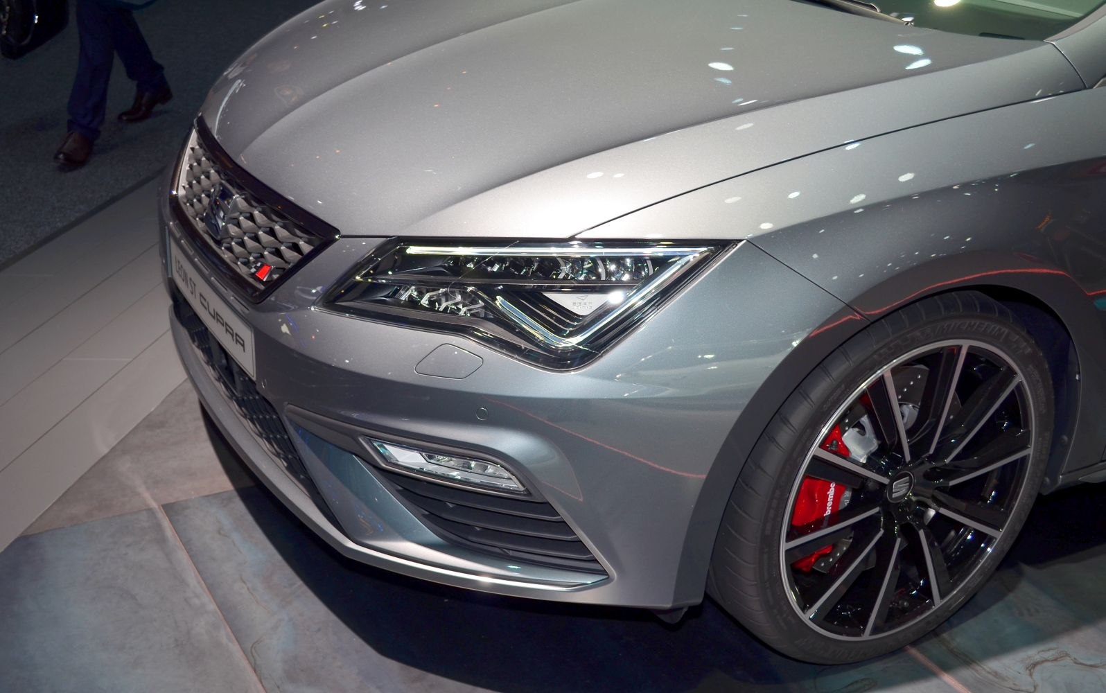 LED headlights and black multi-spoke alloy wheel with red brake caliper