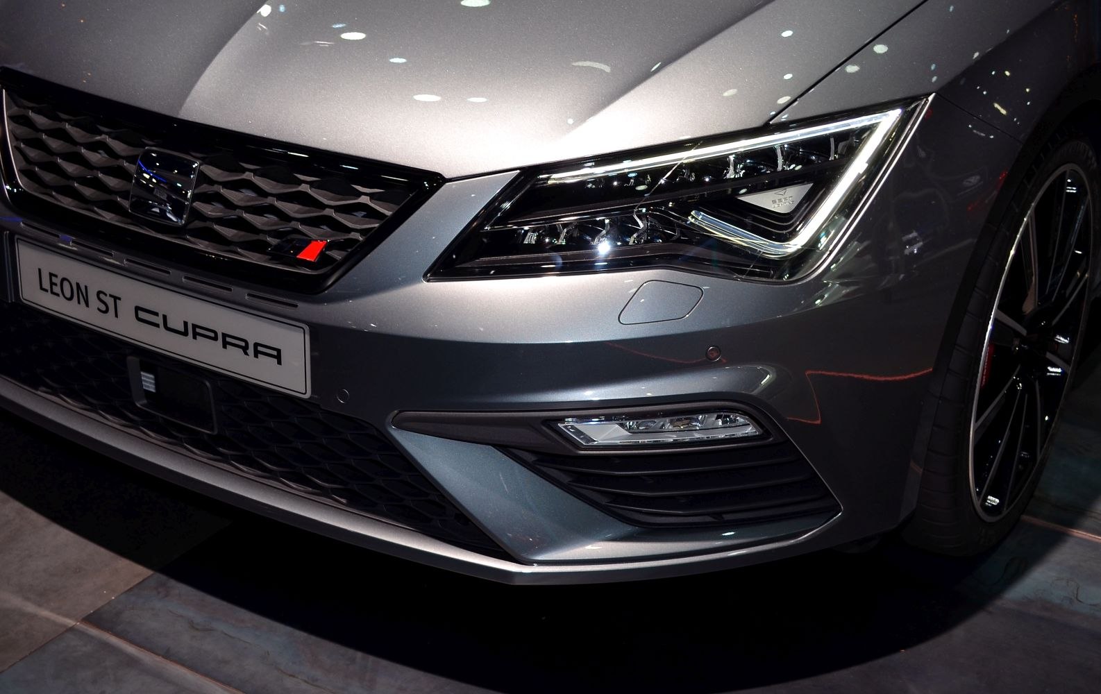 Close-up of front headlight and grille with LED and sporty accents
