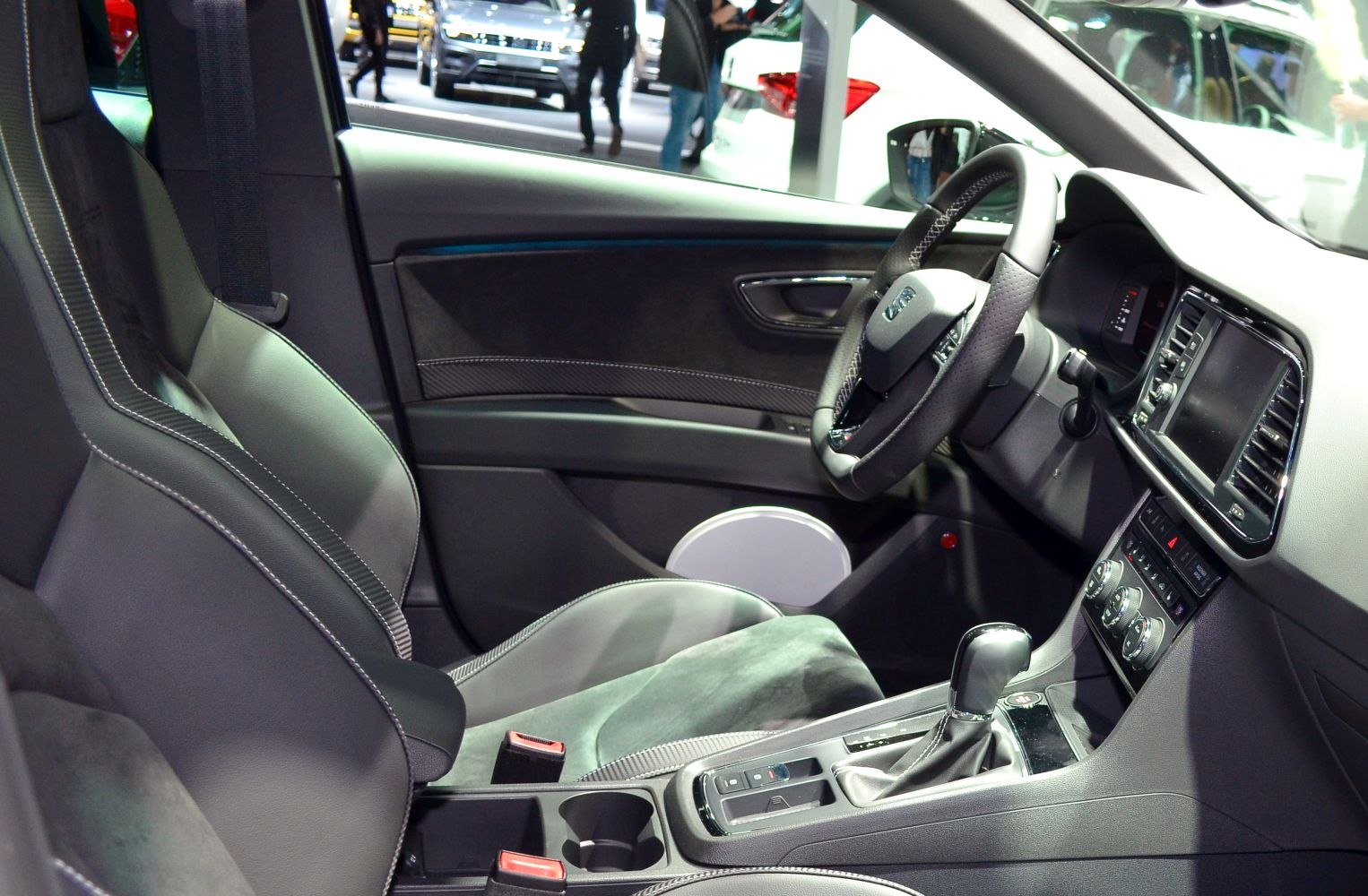 Dashboard, steering wheel, gear shifter, and front passenger seat