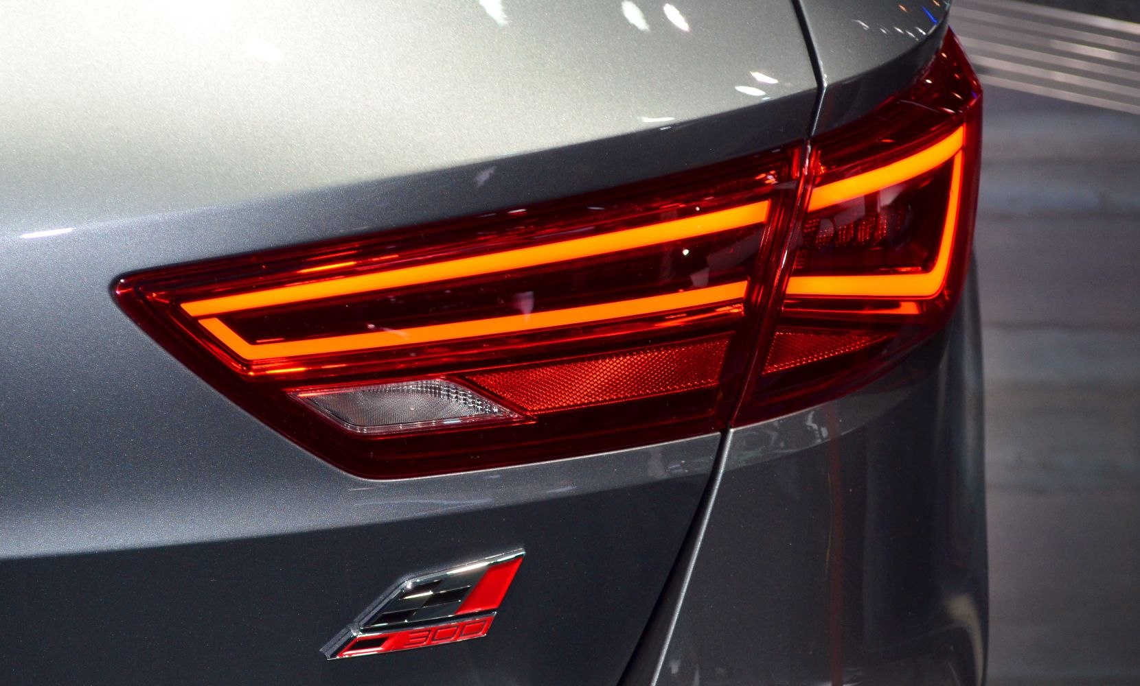 Close-up of a modern LED rear tail light with distinctive geometric light elements.