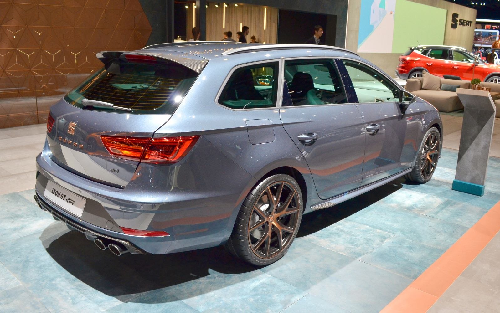 Sporty rear and side view with alloy wheels and quad exhaust