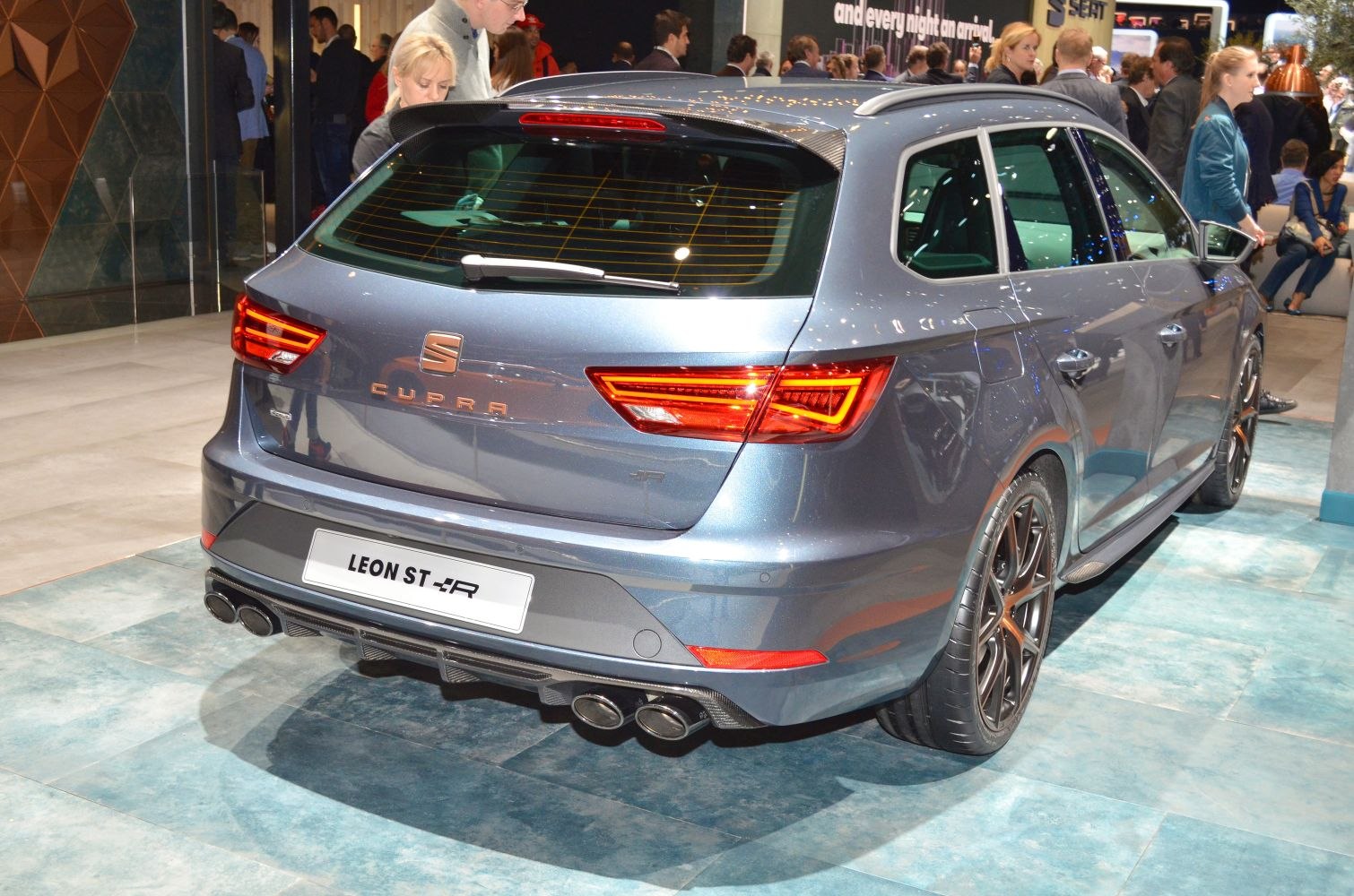 Sporty rear hatchback with LED lights and quad exhaust pipes