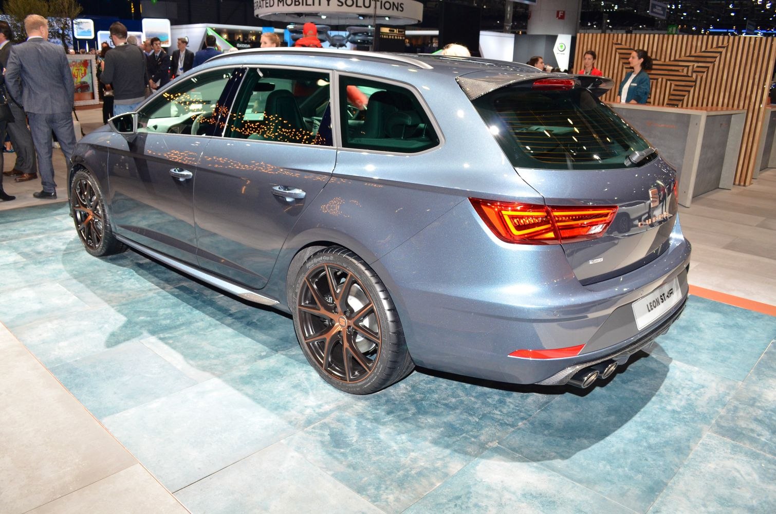 Rear and side view of a metallic grey estate with sporty alloy wheels