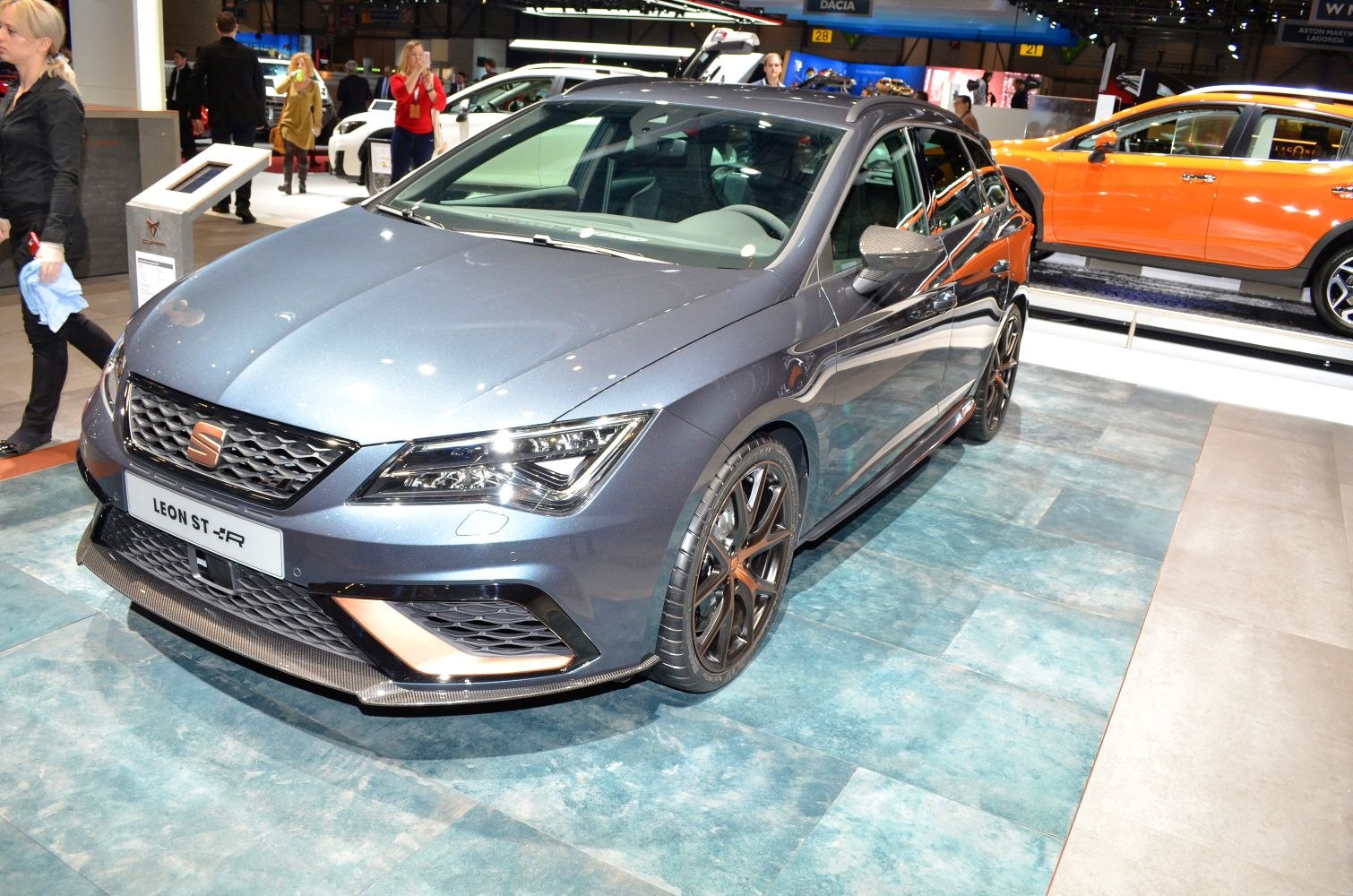Aggressive front grille, sharp LED headlights, black multi-spoke alloy wheels.