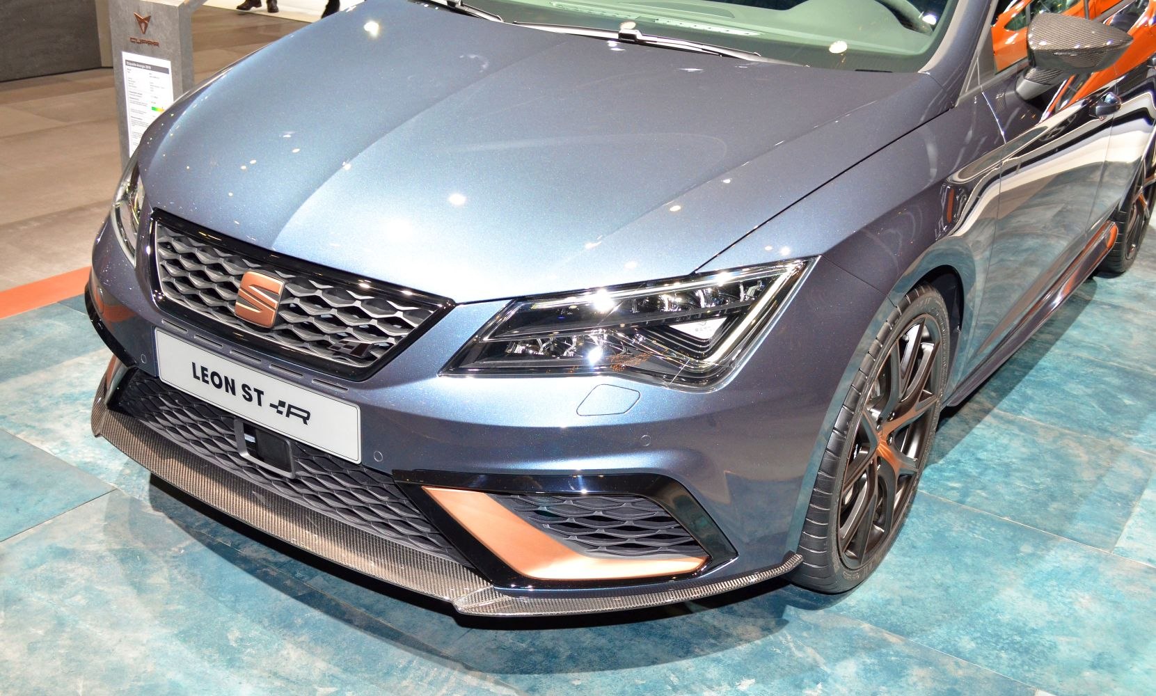 Close-up of front grille, headlights, and sporty bumper details
