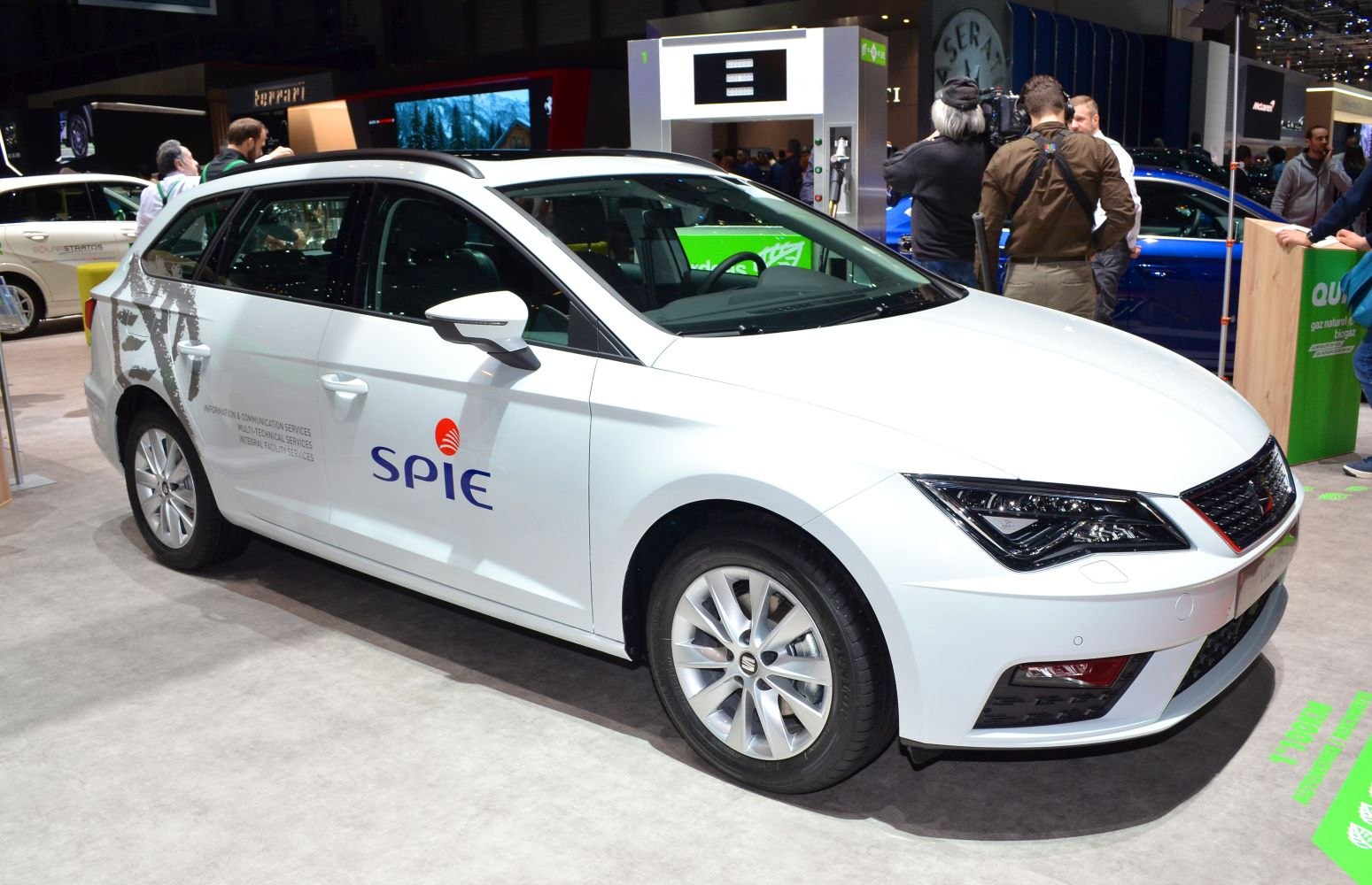 White hatchback with roof rails and LED headlights