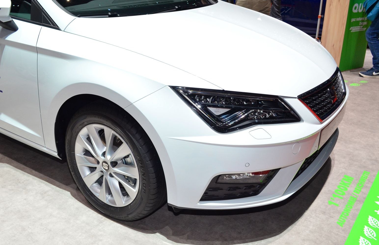 Front view with LED headlight and alloy wheel of white car