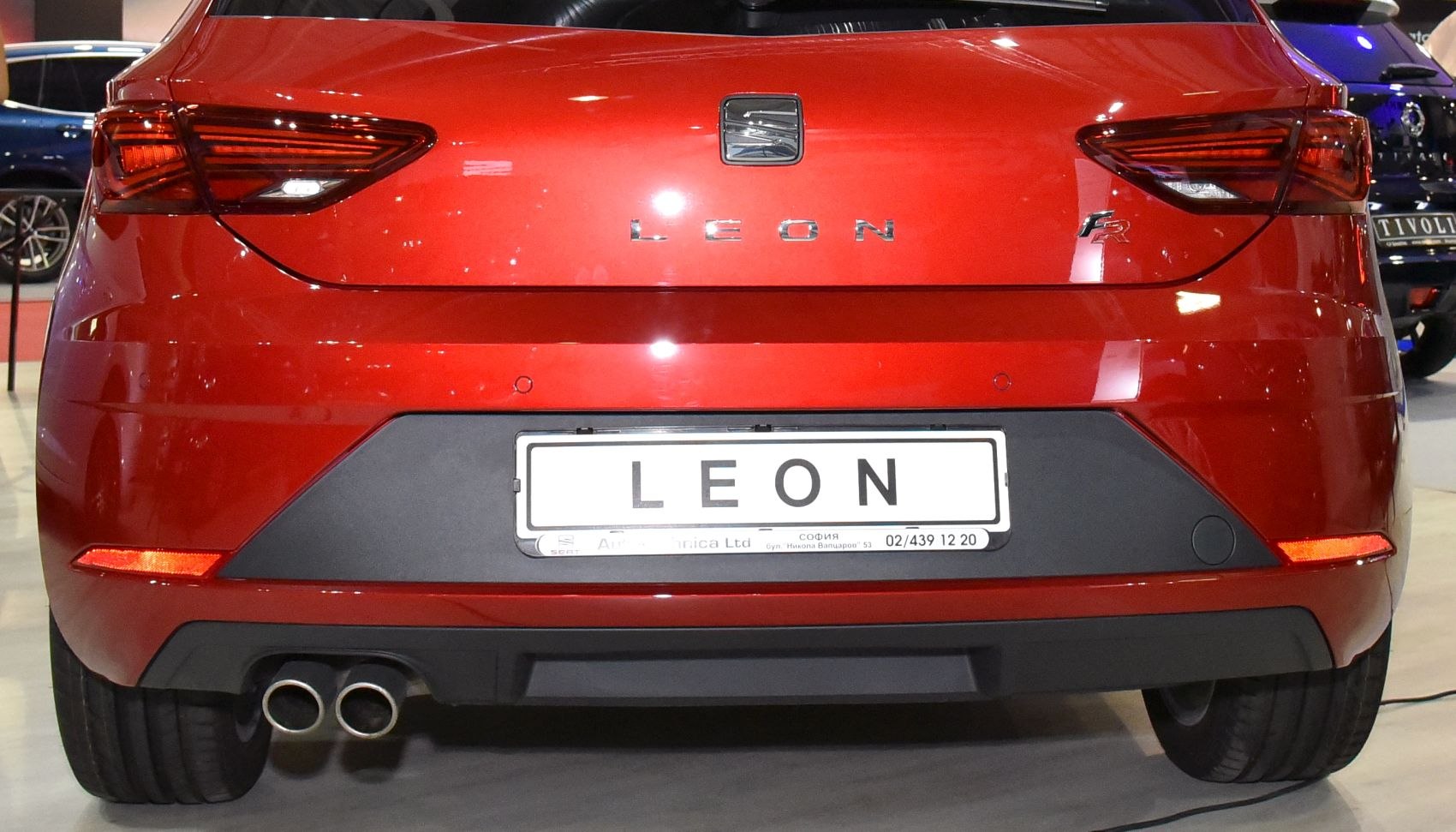 Rear hatchback view with distinct taillights and dual exhaust