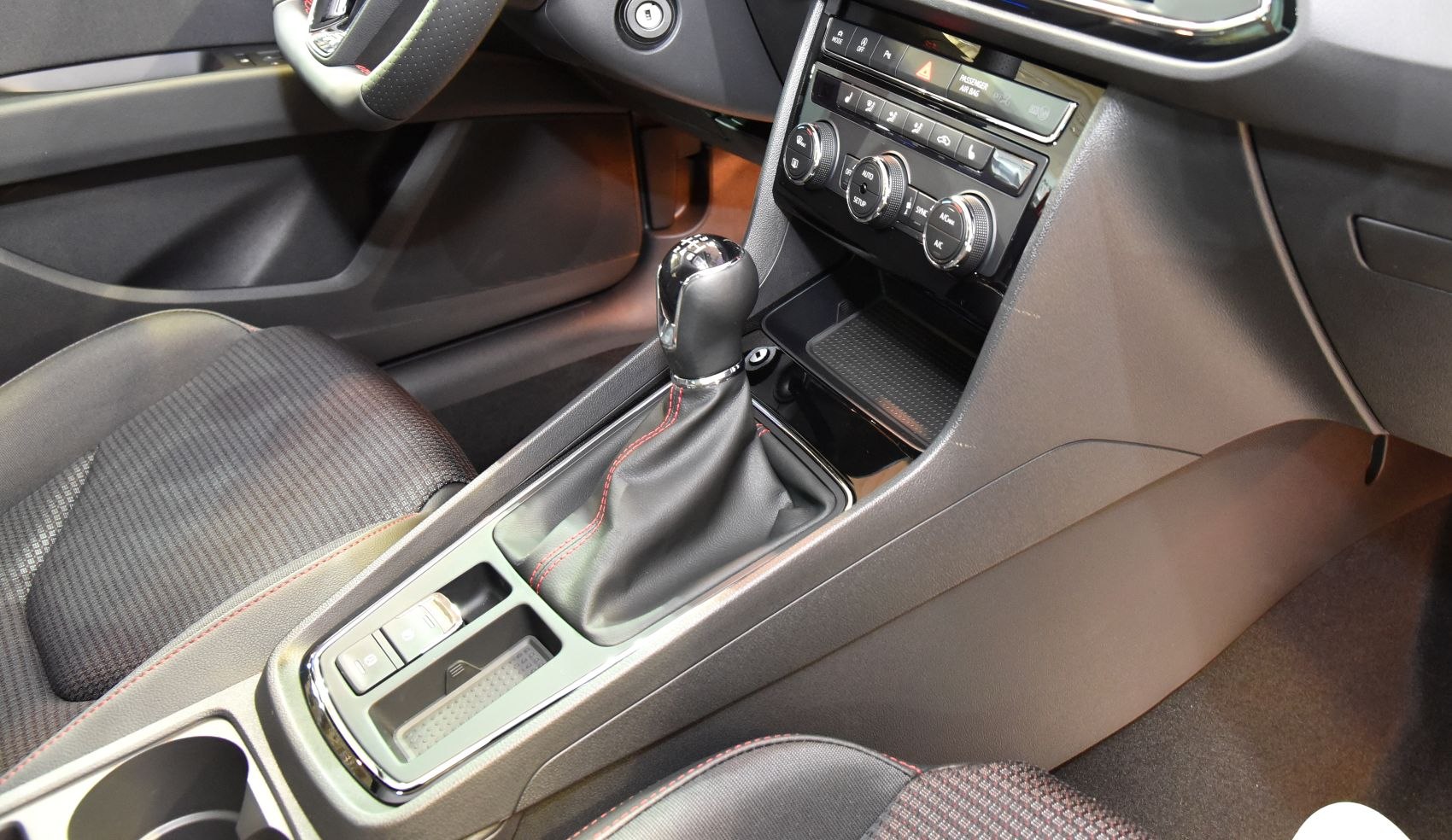 Manual gear shift and center console with climate control dials