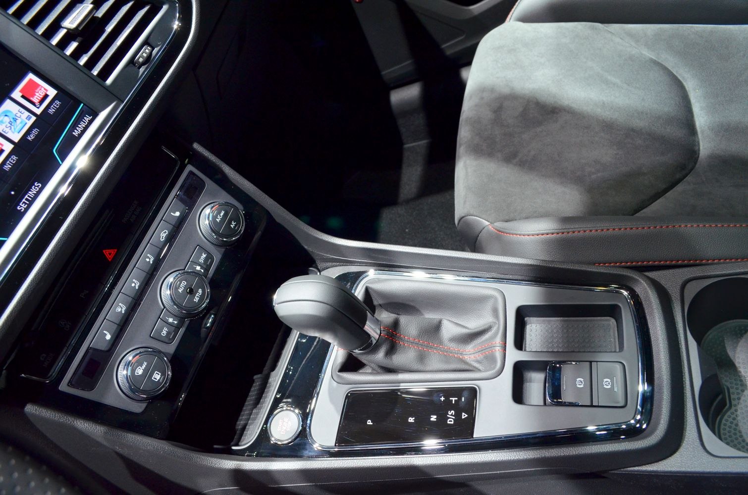 Center console with gear shift lever and climate control dials