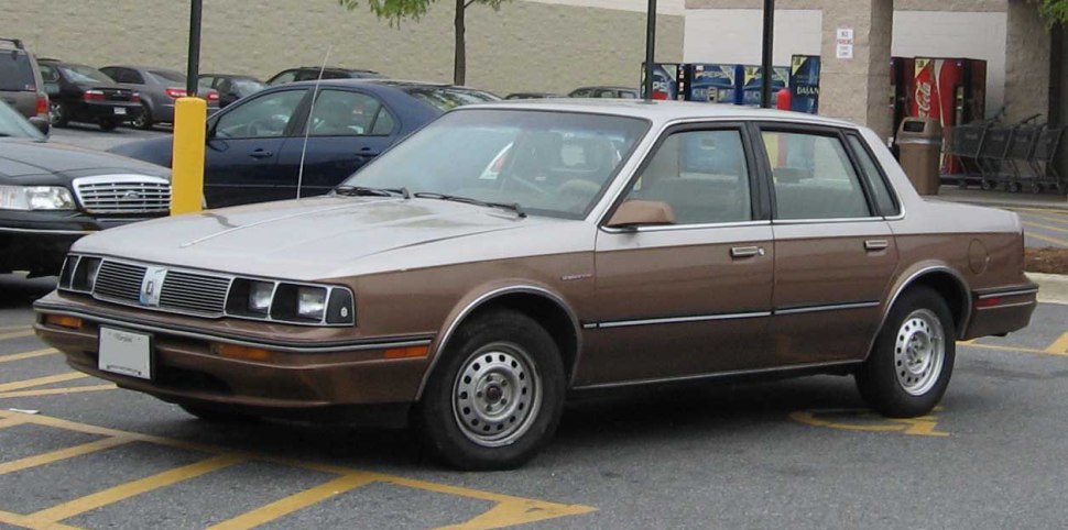 Vintage four-door sedan with rectangular headlights and boxy design.