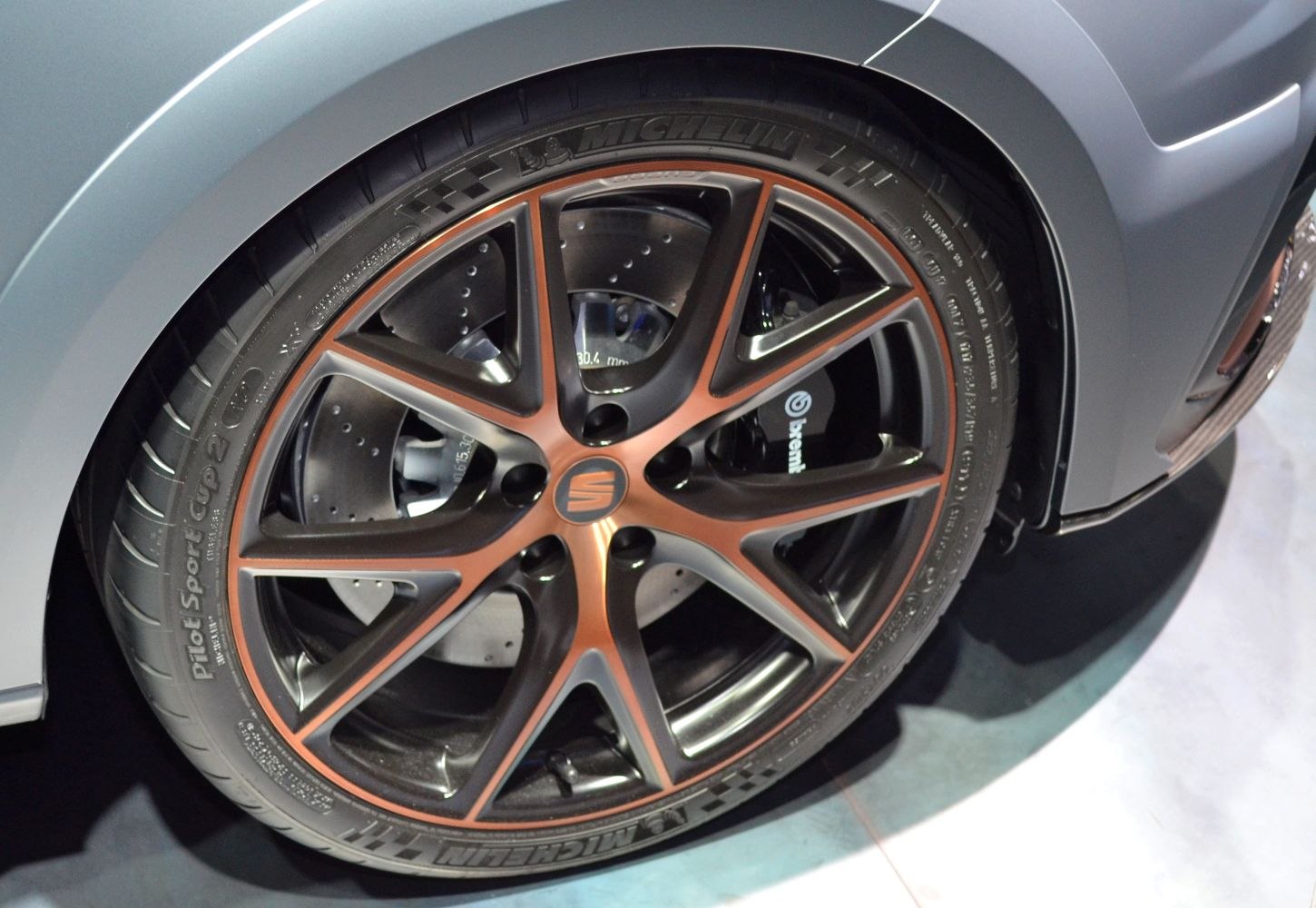 Multi-spoke alloy wheel with Brembo brake caliper and ventilated disc