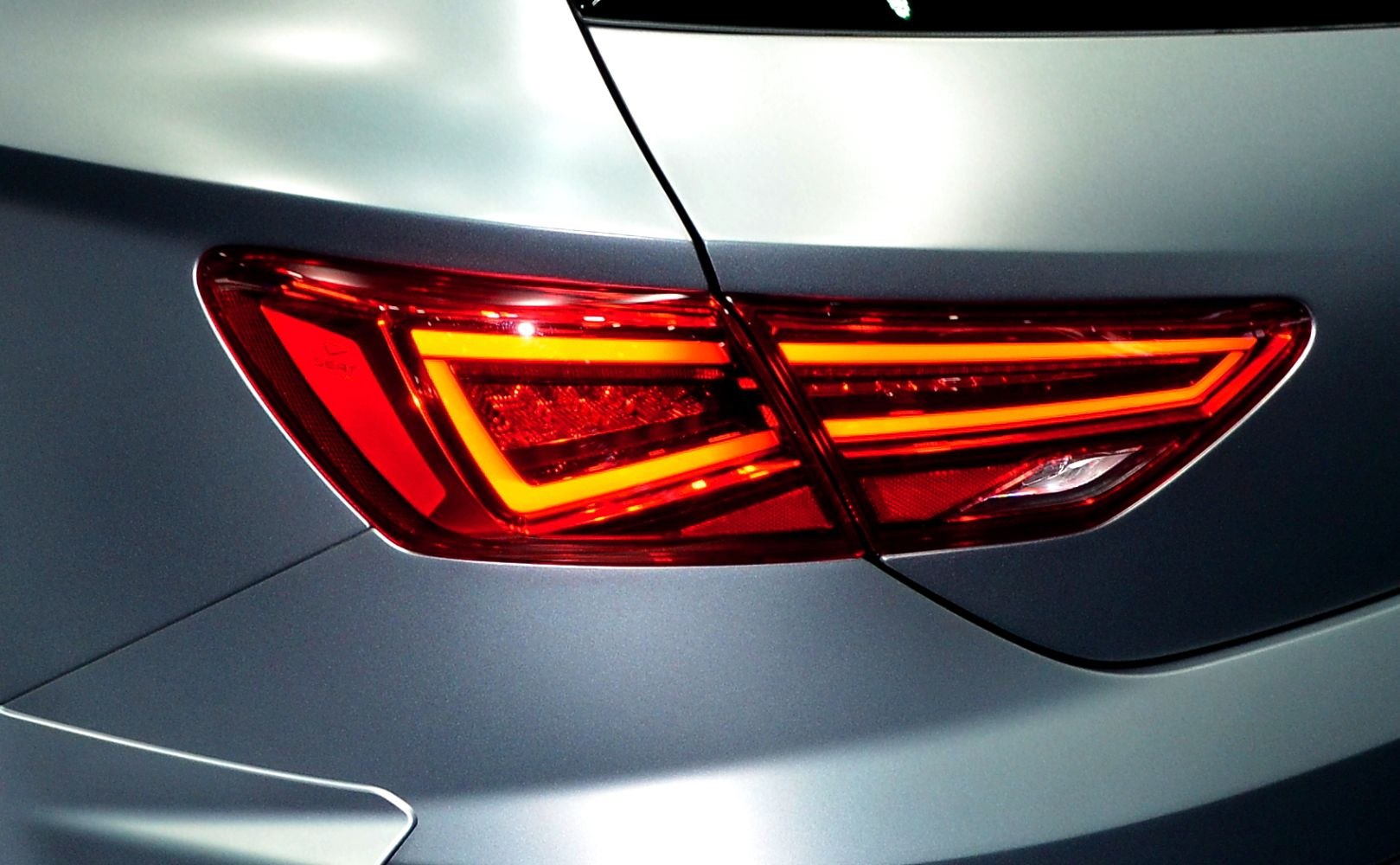 Rear LED taillight with sharp angular design and bright outline lighting