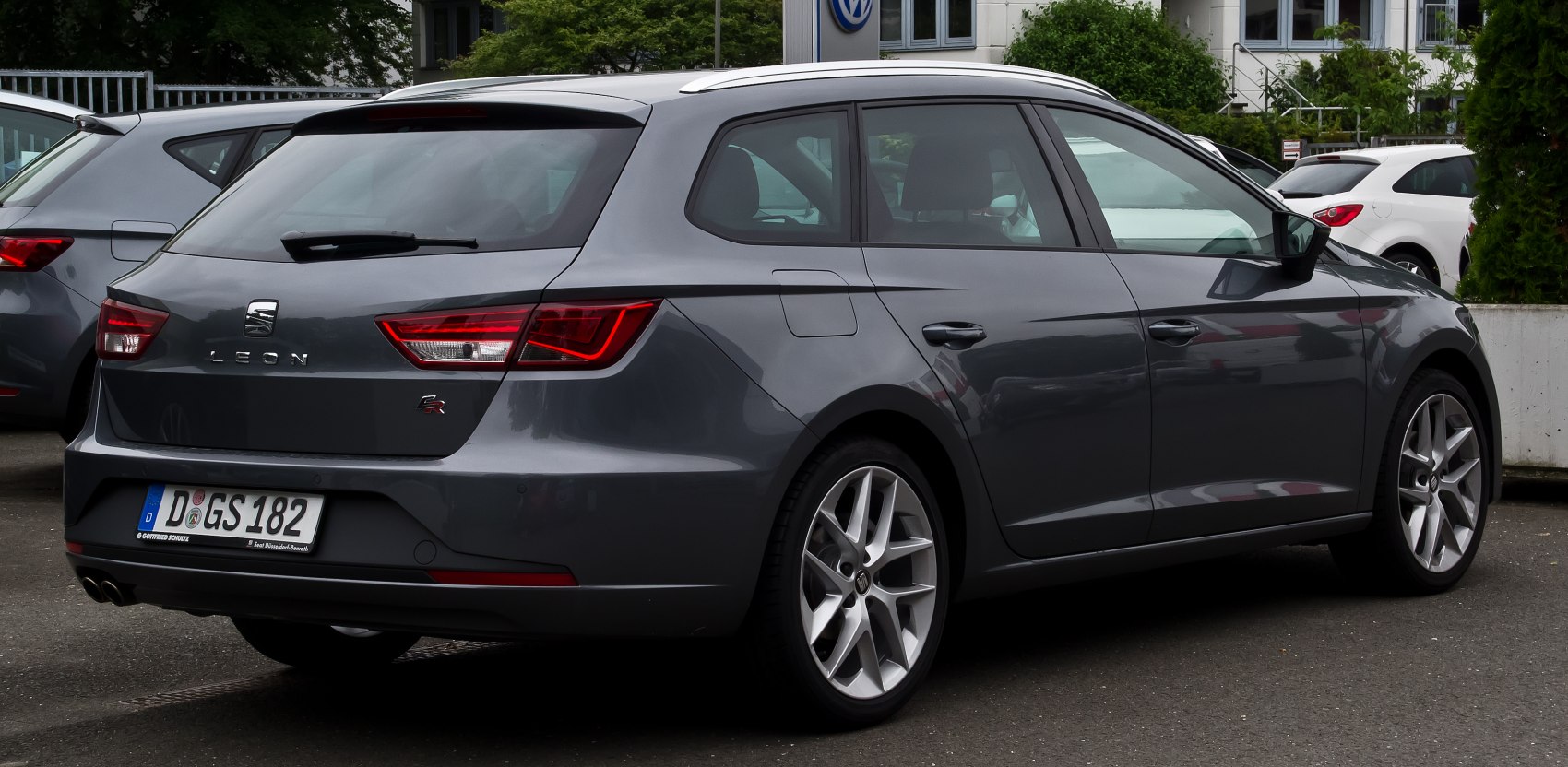 Rear and side profile with sporty taillights and alloy wheels of a modern estate car