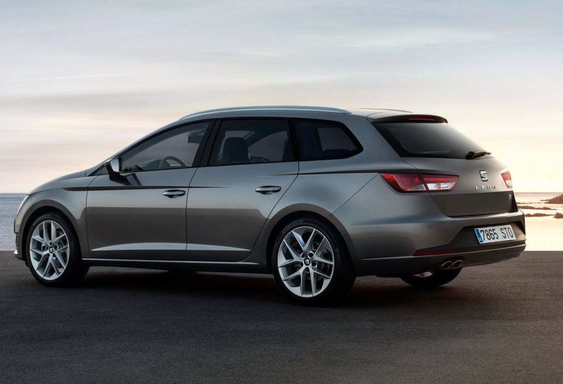 Side profile of station wagon with alloy wheels and dual exhaust
