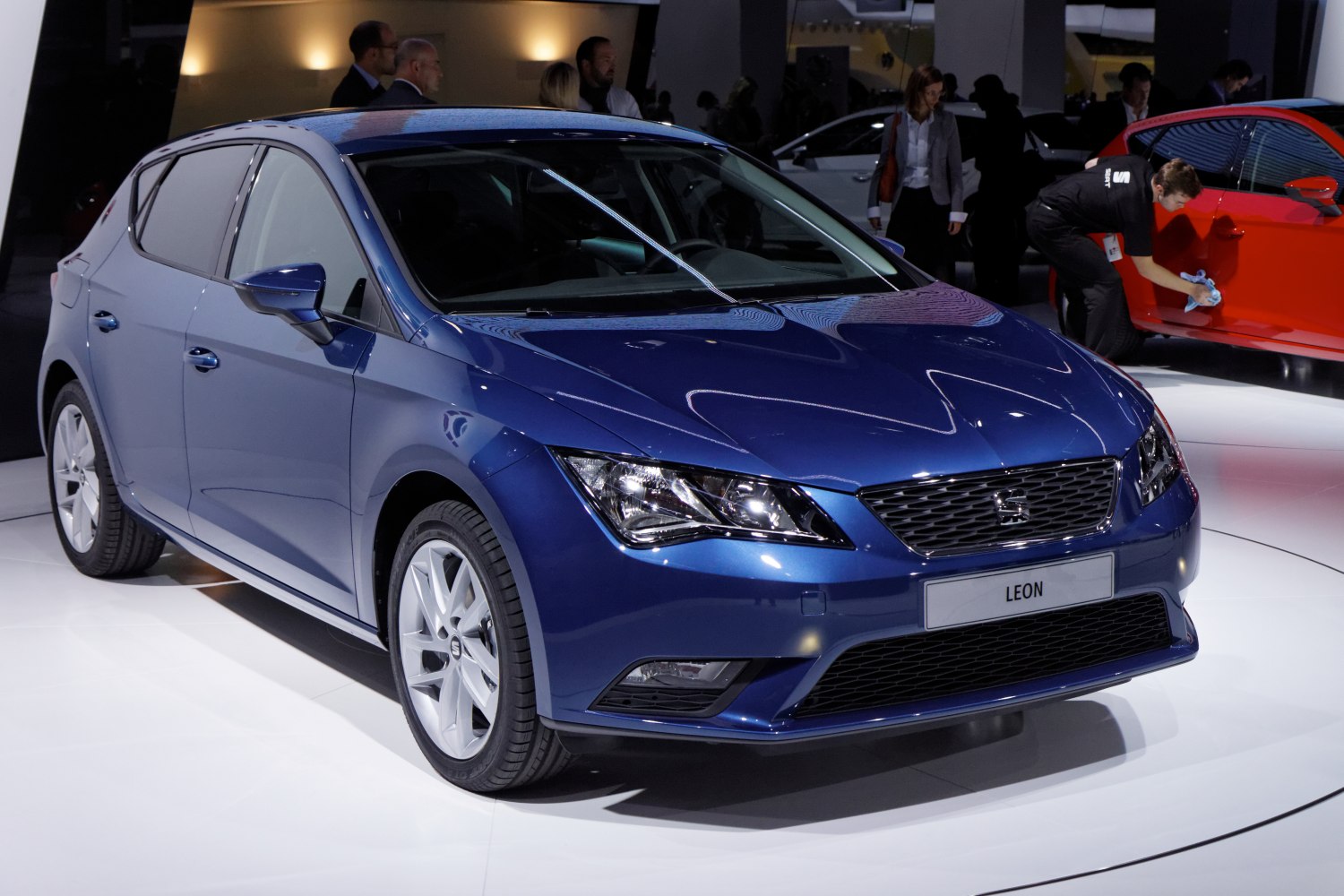 Blue hatchback front view with LED headlights and sporty grille