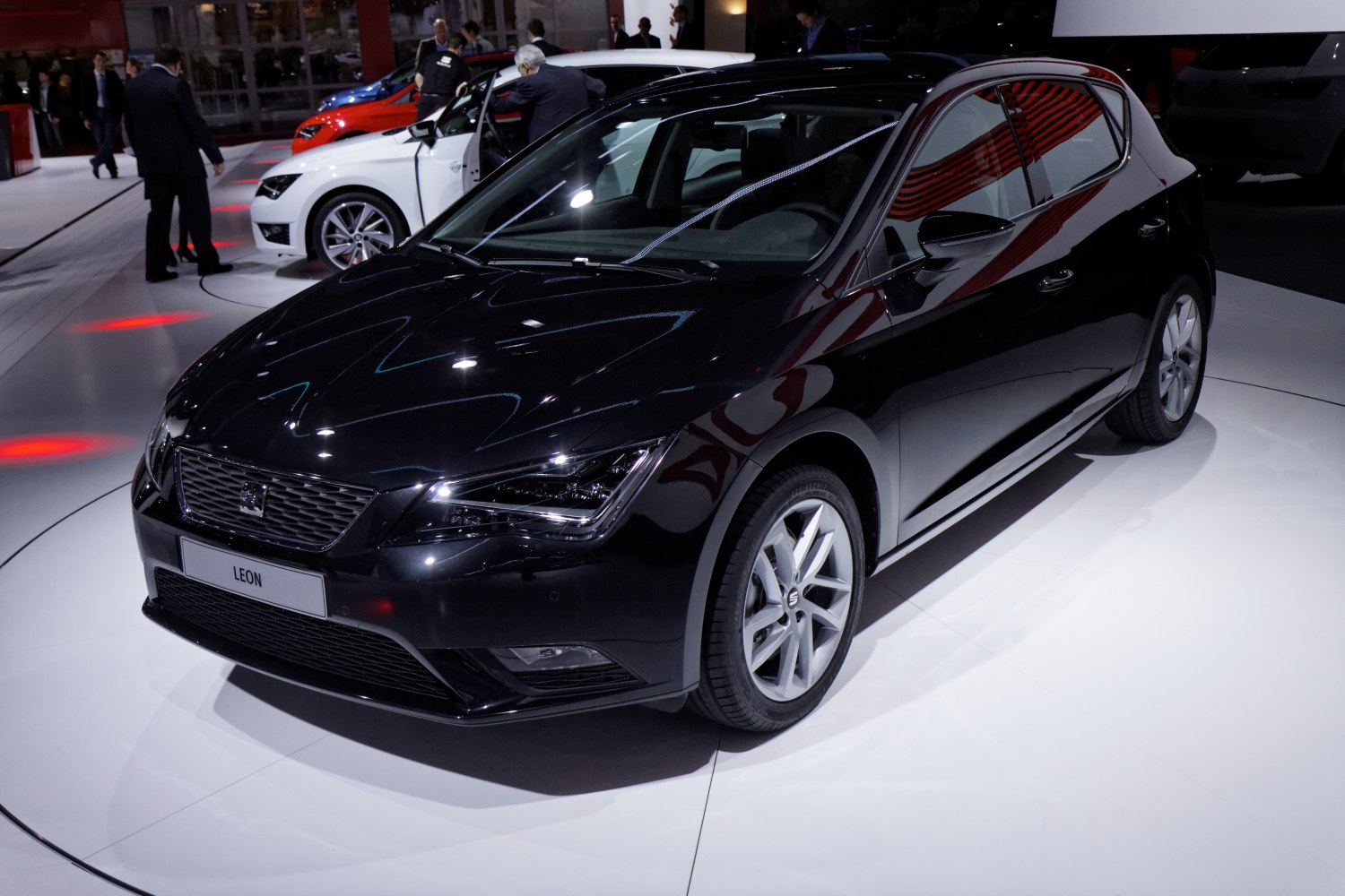 Black hatchback showing front grille, headlights, and side profile