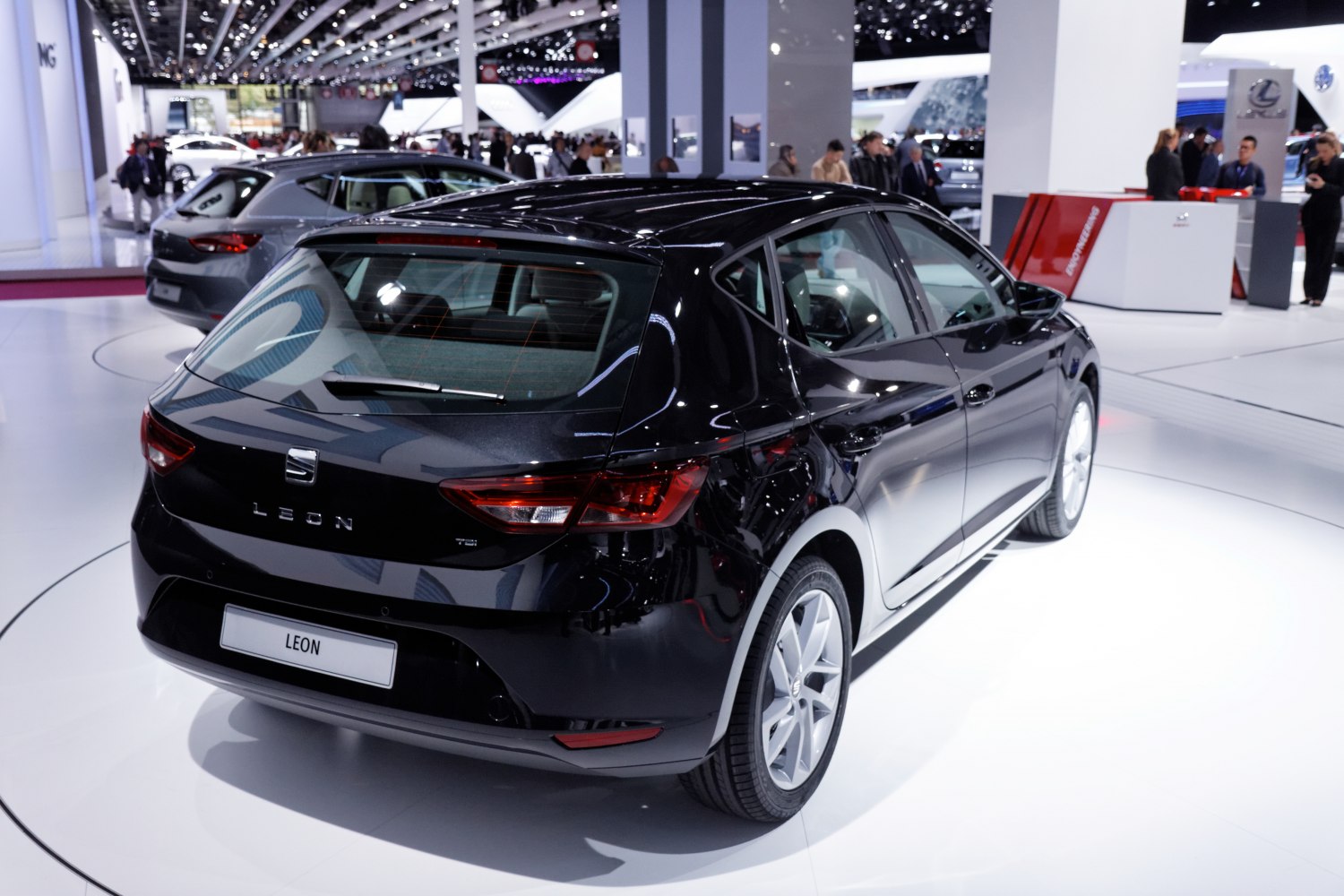 Rear view of sleek black hatchback with angular tail lights and five-door layout