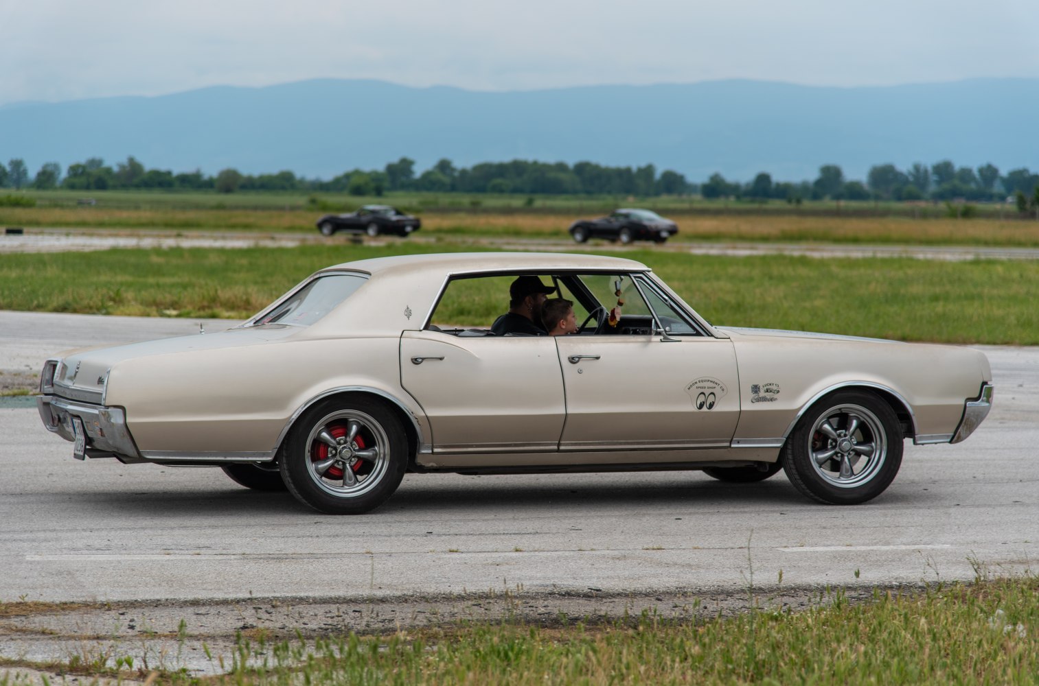 Side profile of classic vintage sedan with custom wheels
