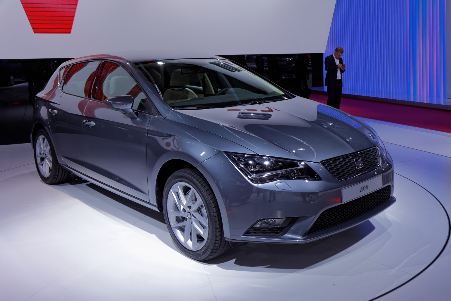 Sleek front and side hatchback view with sharp headlights and alloy wheels