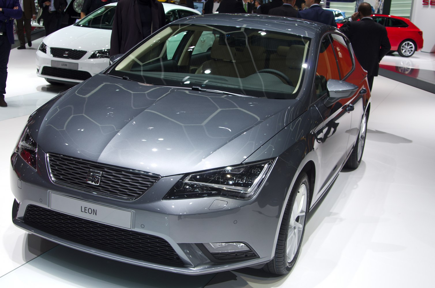 Gray hatchback front with sharp headlights and sporty grille