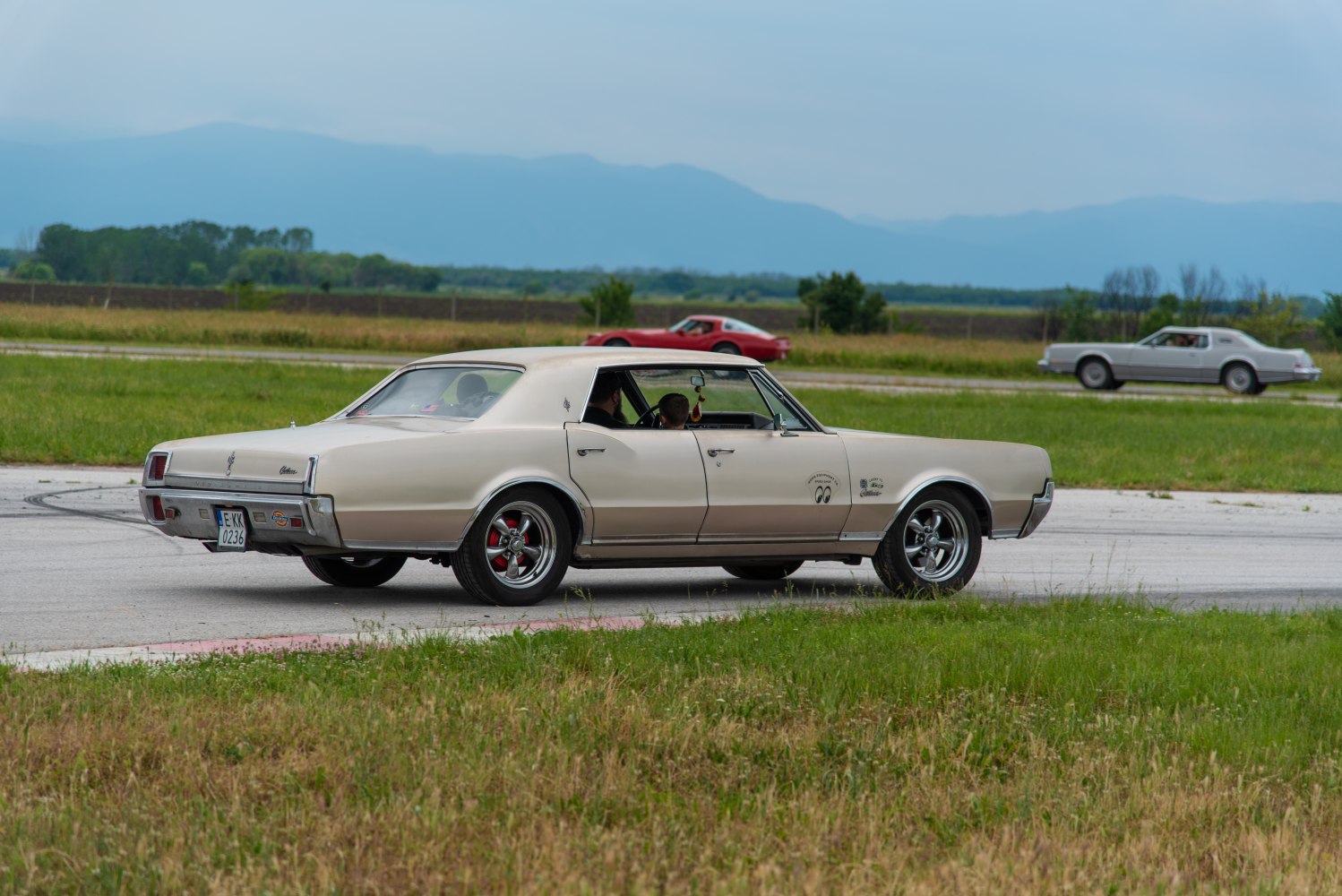 Side profile of a classic vintage sedan with custom wheels