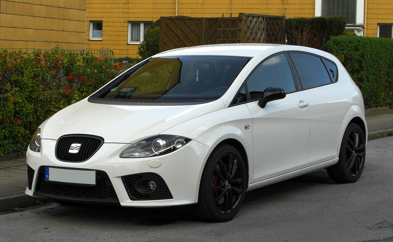 Sporty compact hatchback with aggressive front and black wheels