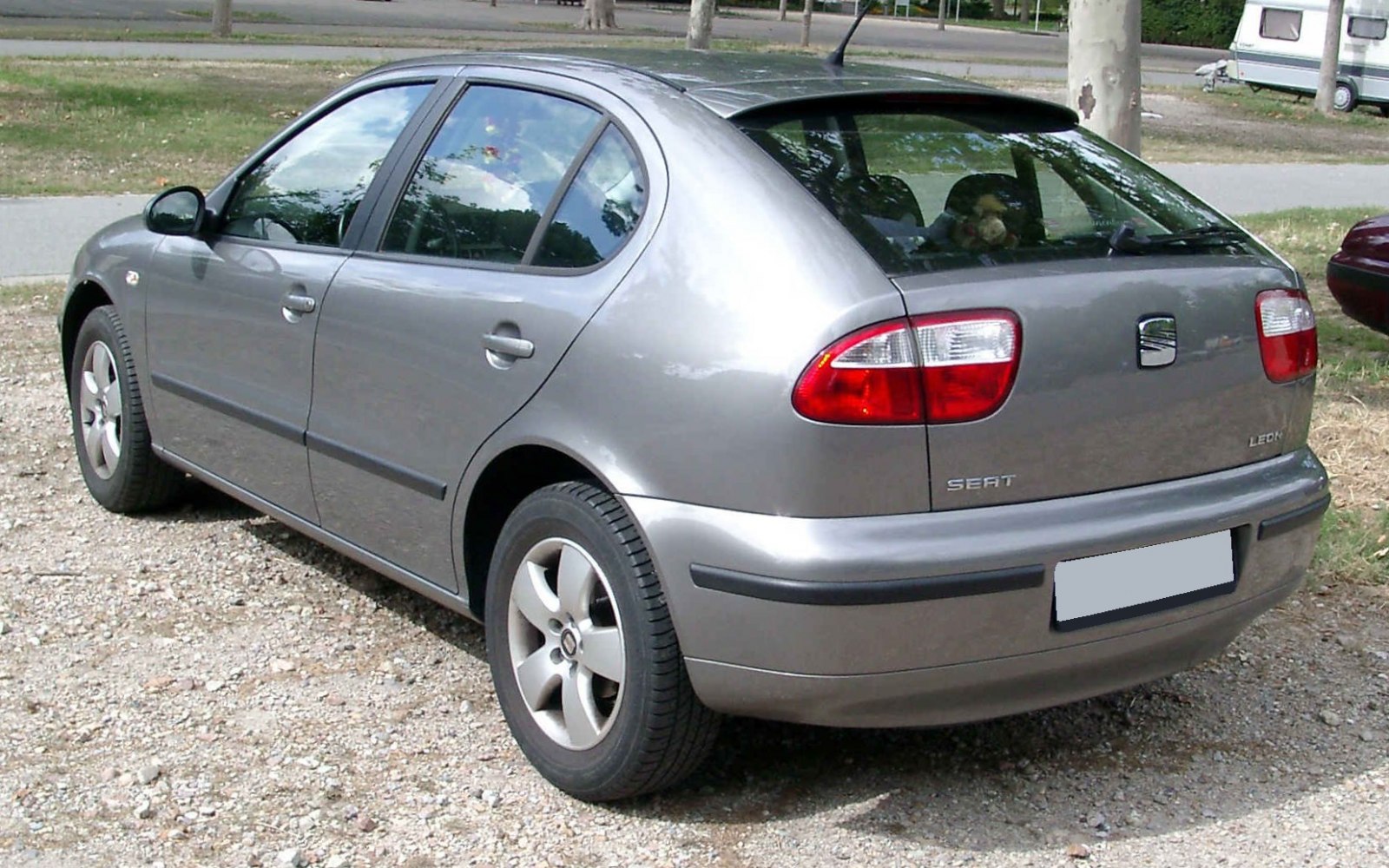 Rear and side hatchback view with distinct taillights and alloy wheels