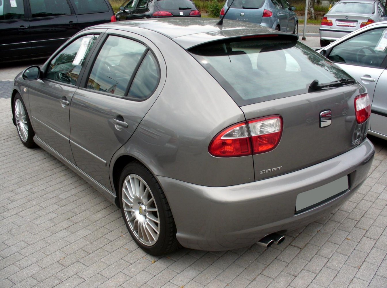 Rear view hatchback with dual exhaust and alloy wheels