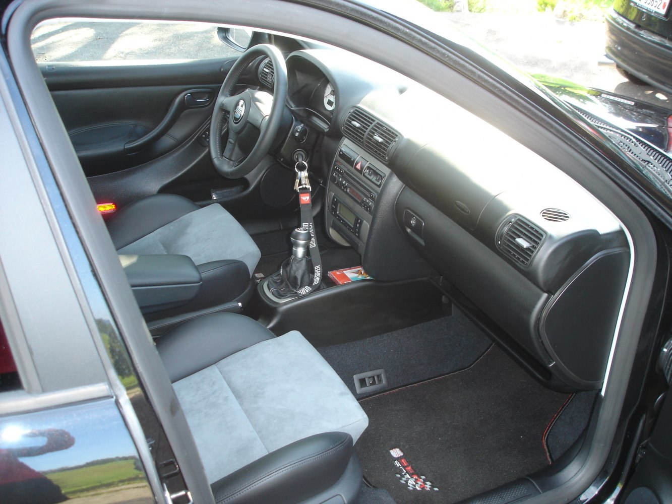 Manual gearbox with steering wheel and dashboard interior