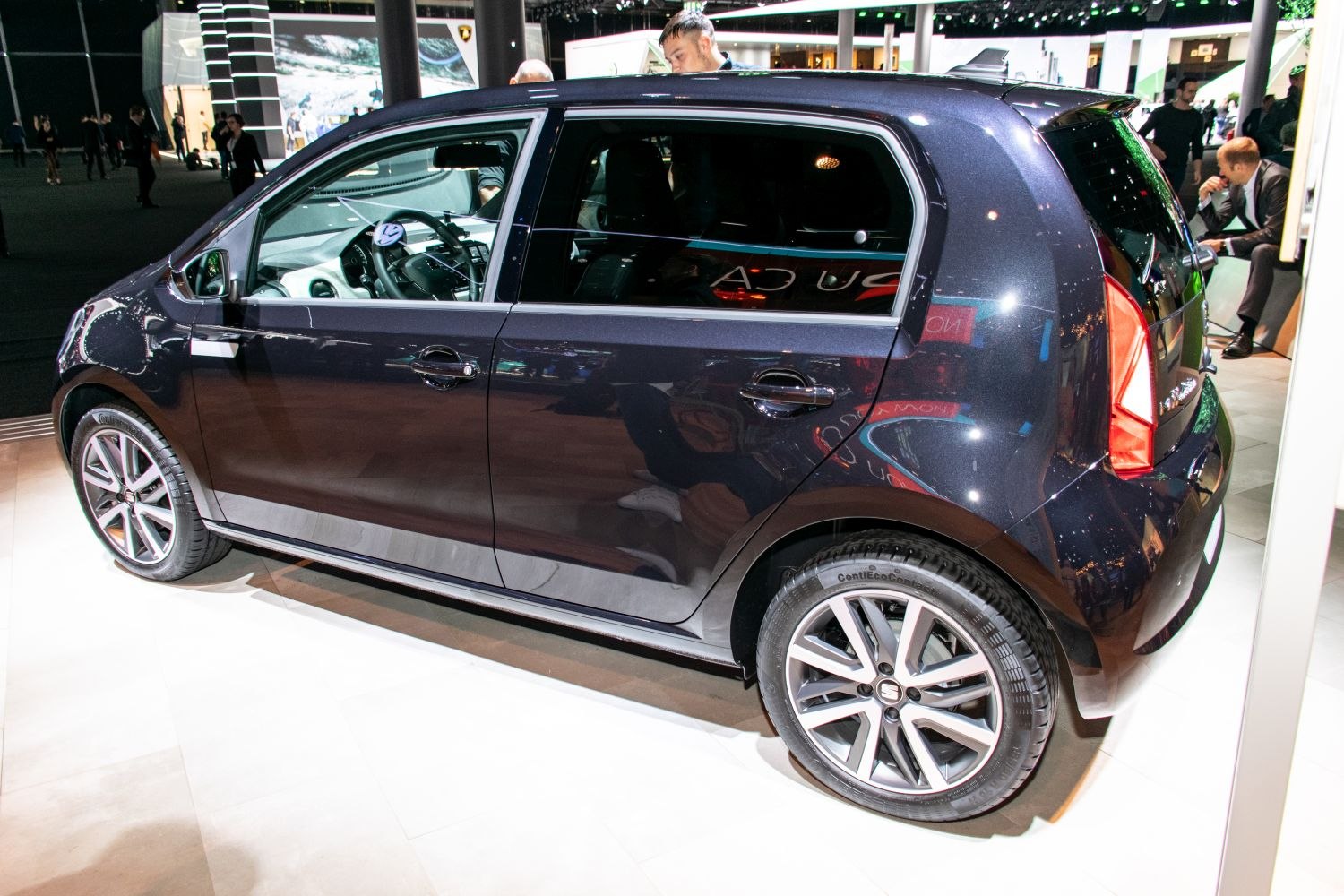 Side view of a small hatchback with alloy wheels and four doors