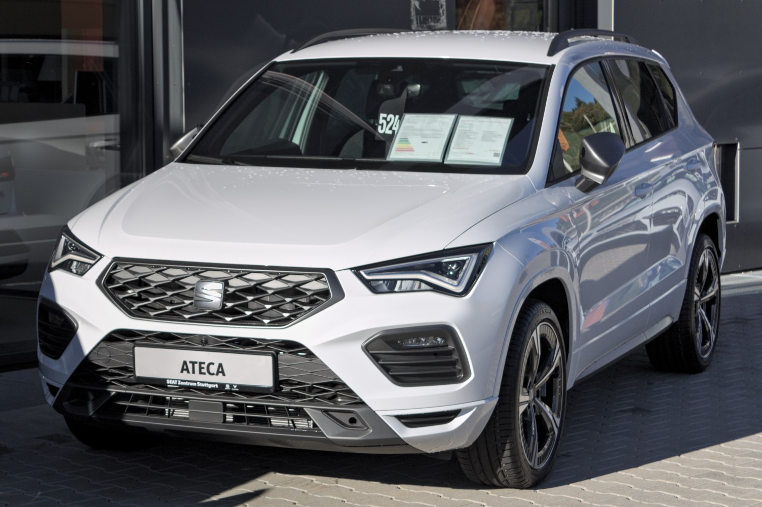 Modern SUV front view with detailed grille and LED headlights