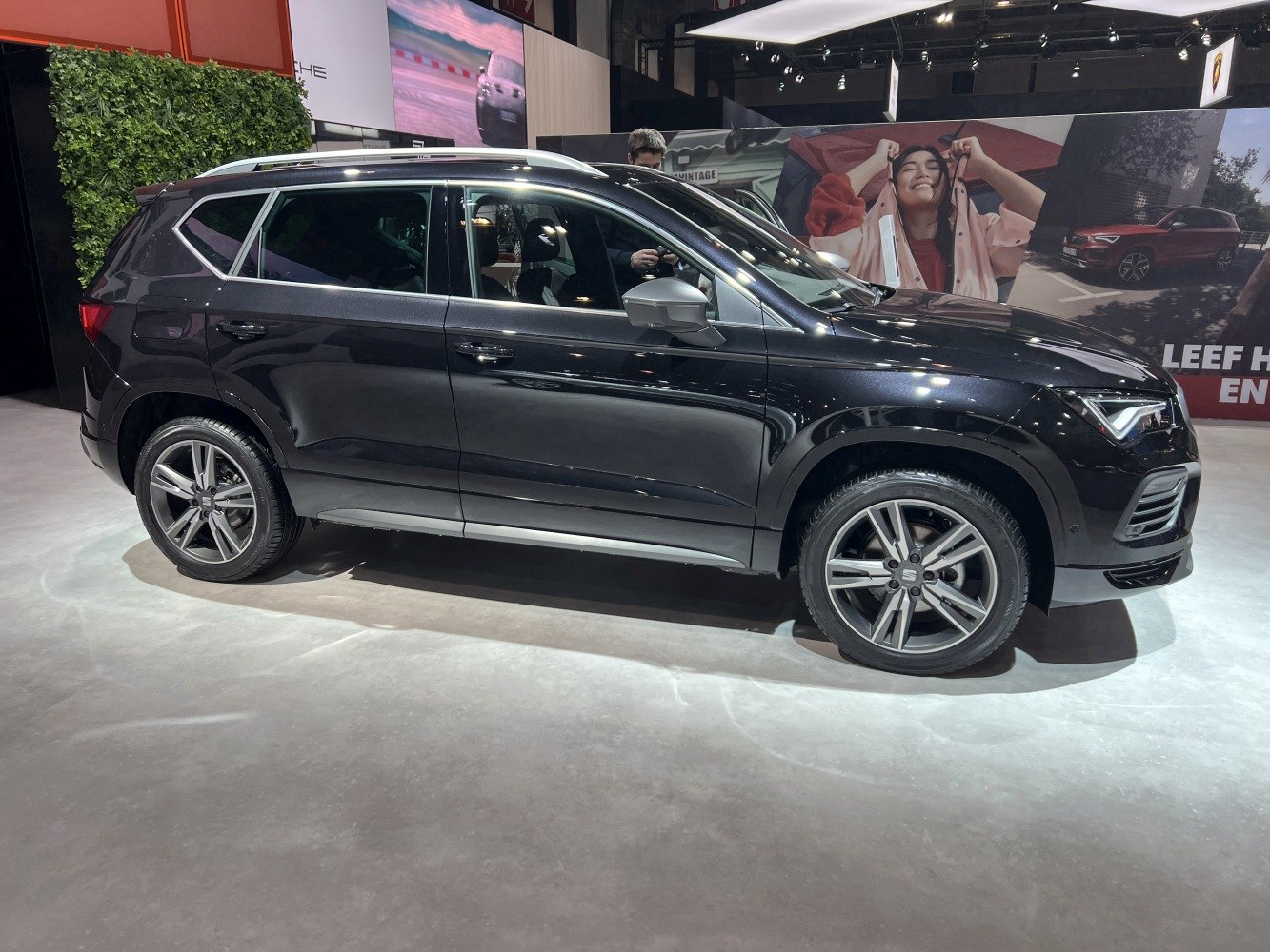 Side view of an SUV with alloy wheels and roof rails