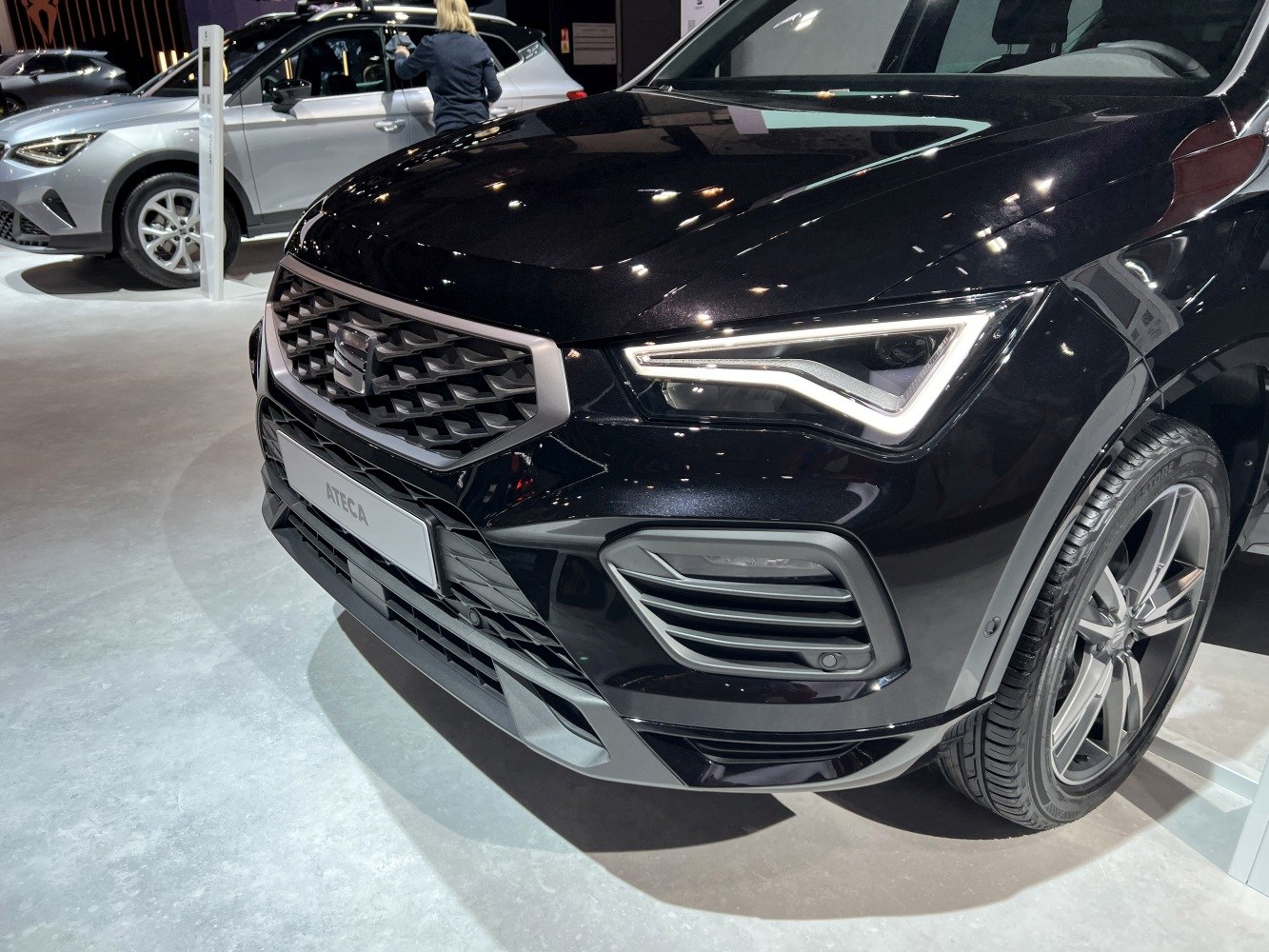 Close-up of front grille and LED headlight design with alloy wheel