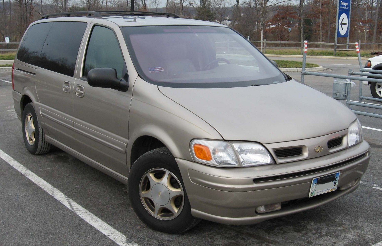 Front and side view of a 1997 minivan with sliding doors and distinct headlights