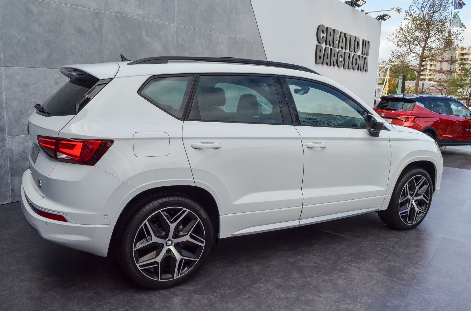 White mid-size SUV side view with LED tail lights and alloy wheels