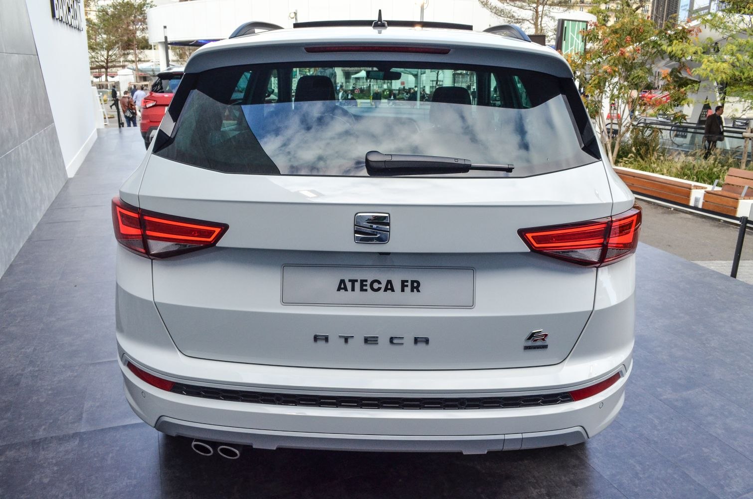 Rear LED tail lights and dual exhausts of a compact SUV