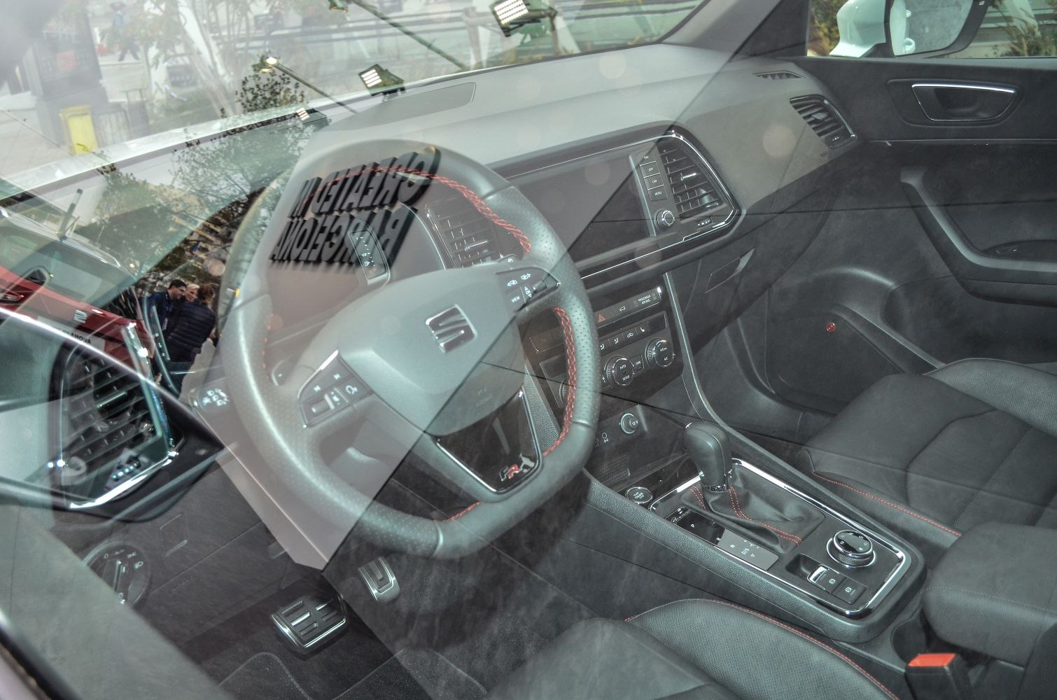 Steering wheel, center console, gear shift, and car pedals of vehicle interior