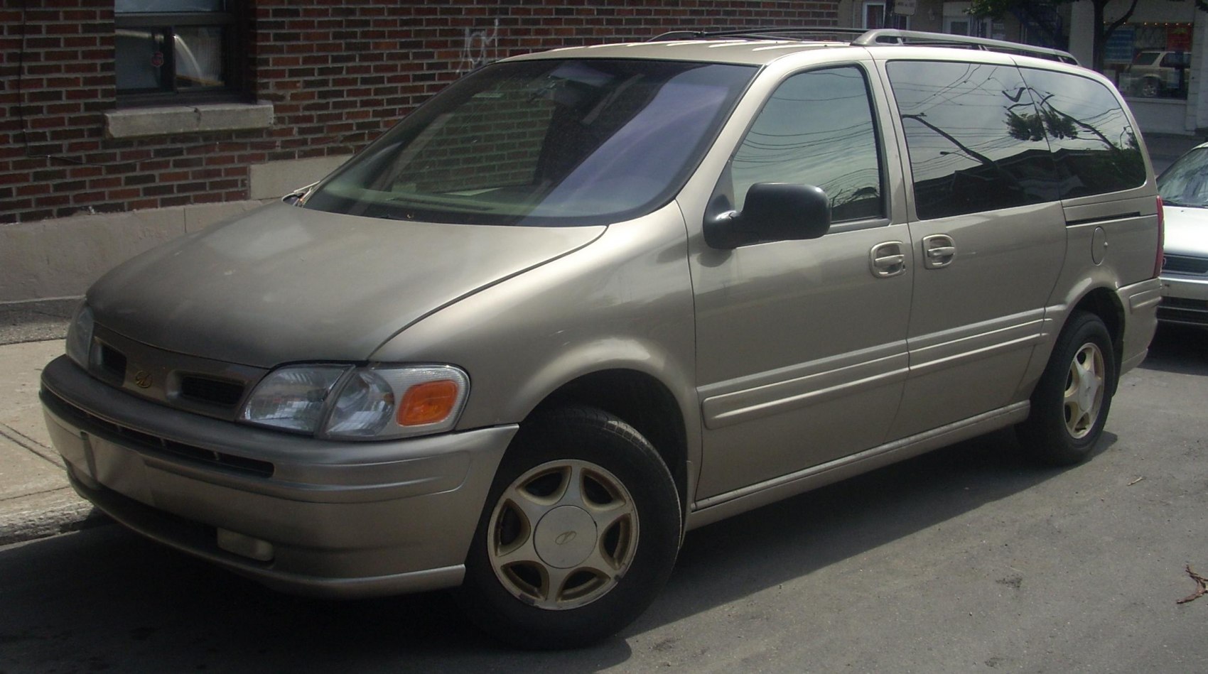 Minivan with sliding side doors and alloy wheels