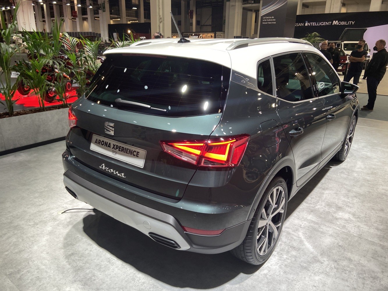 Rear-side view showing LED tail lights and alloy wheels with two-tone roof design