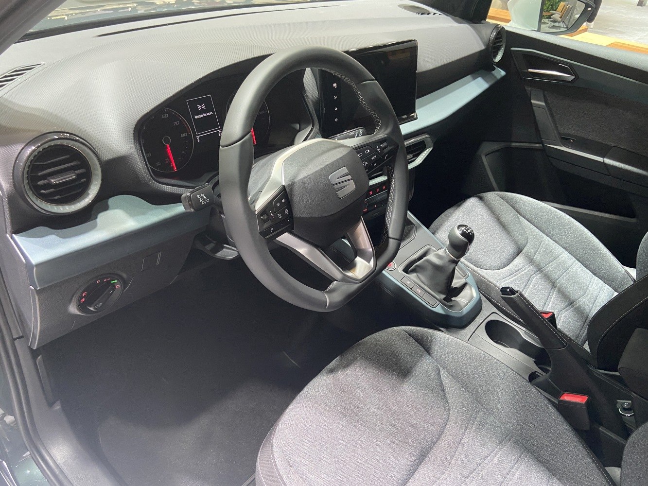 Modern car interior with manual gear and digital dashboard display