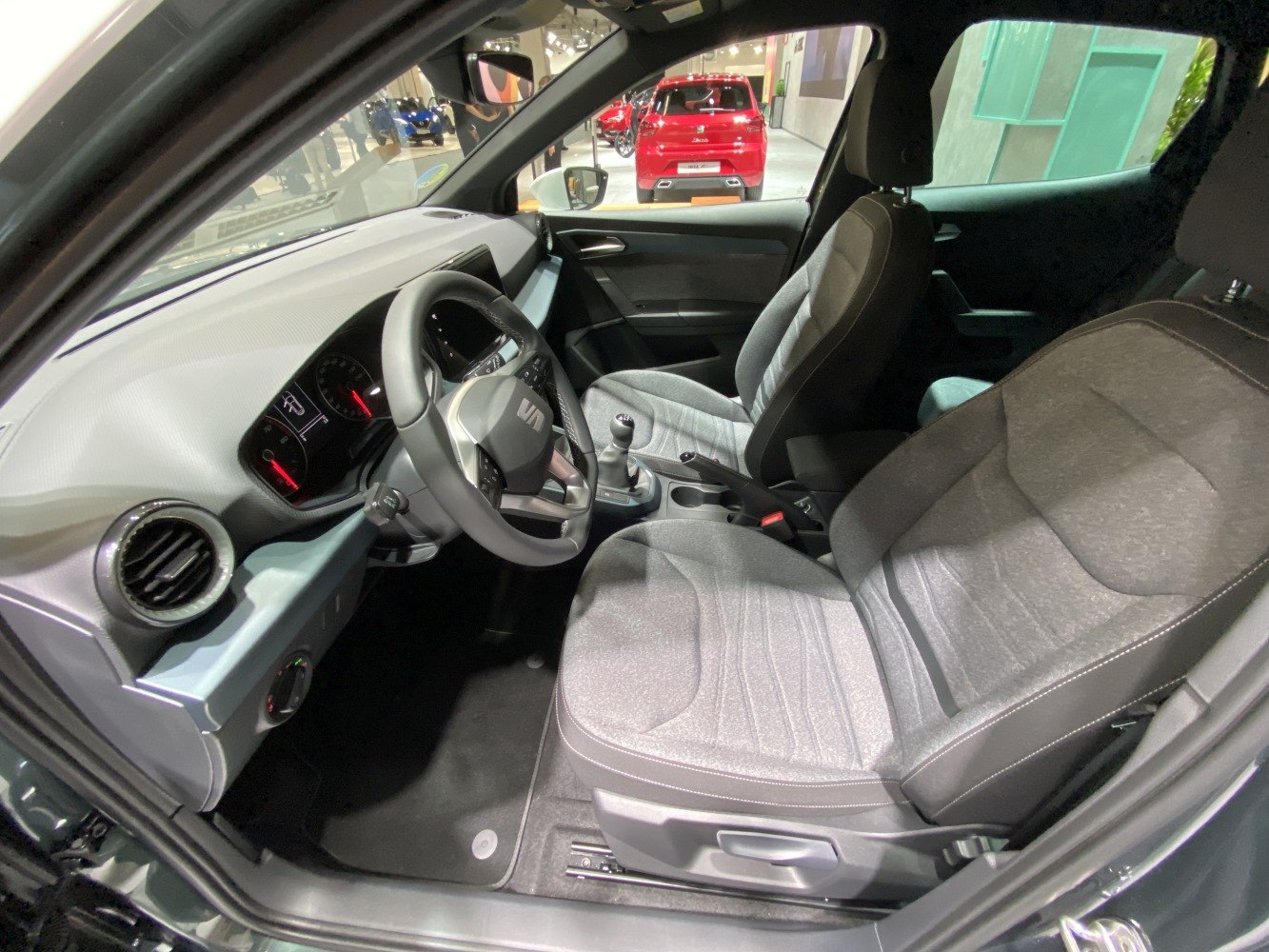 Modern dashboard with digital console and fabric front seats